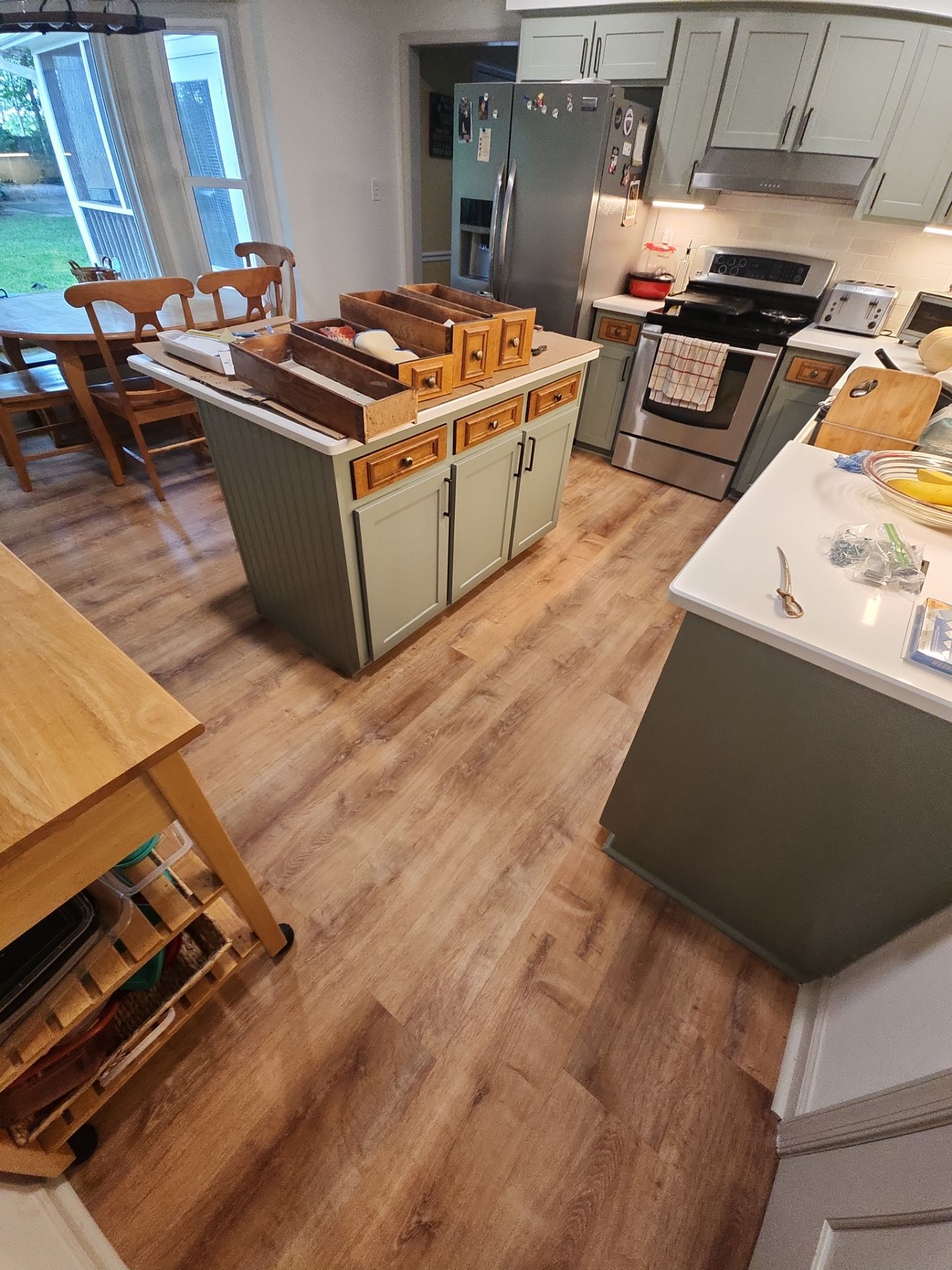 A Pathway to Personality – A Two-Tone Kitchen Transformation in Apex by Elite Remodeling and Design LLC