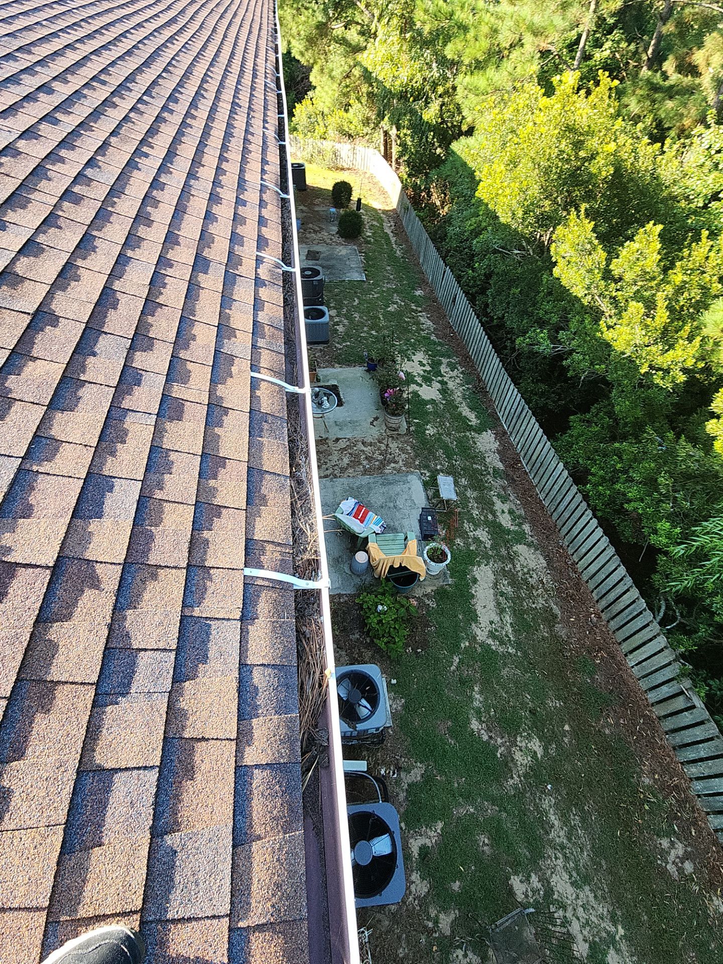 Commercial gutter cleaning Outer Banks & Kill Devil Hills before photo with filled gutters