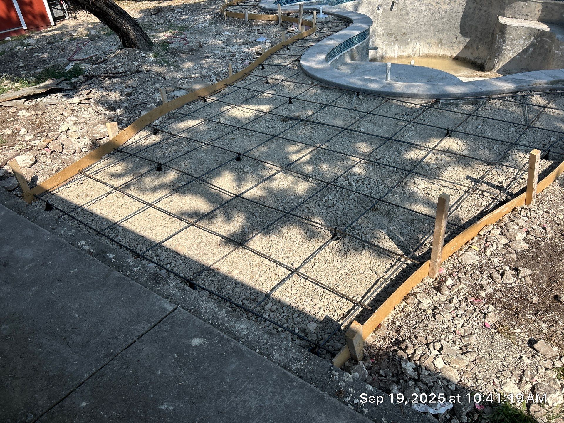 Freeform Pool Remodel with New Decking and Pebble Interior by Pinnacle Pools and Spas - DFW