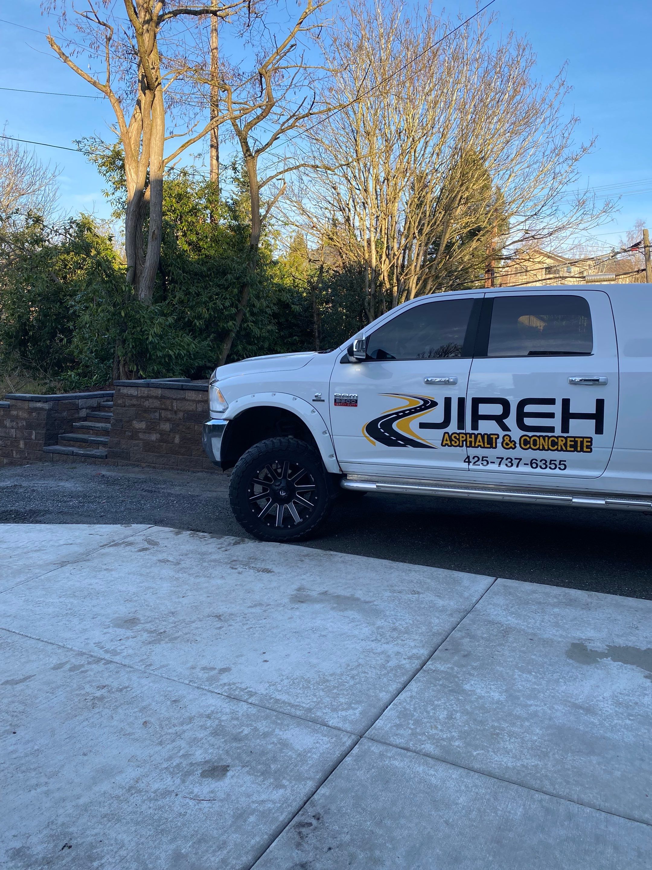 Patio Installation using Concrete, Retaining walls, and Turf install by Jireh Asphalt & Concrete Inc 