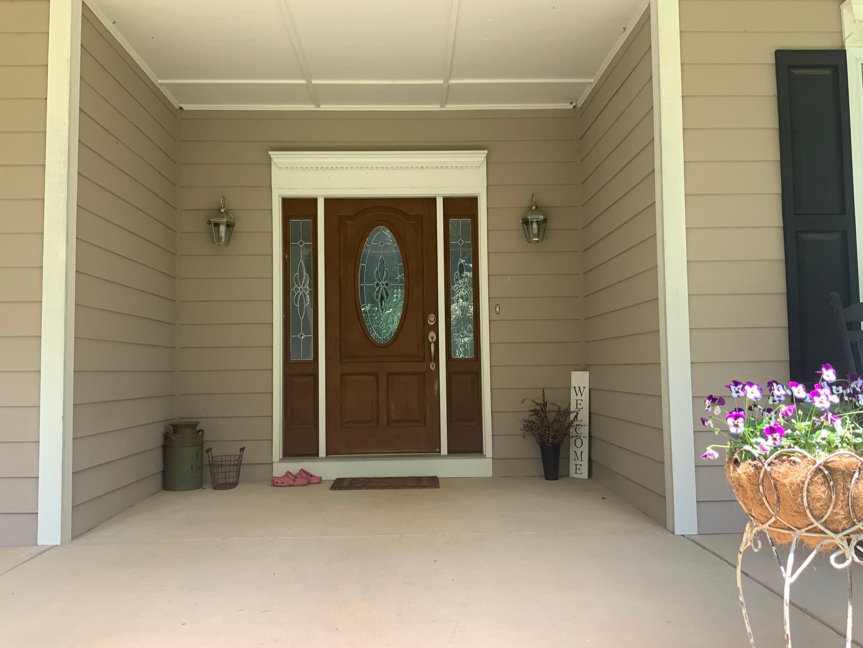Siding replacement, exterior painting, and front door staining. by GonzalezPainters & Contractors Inc