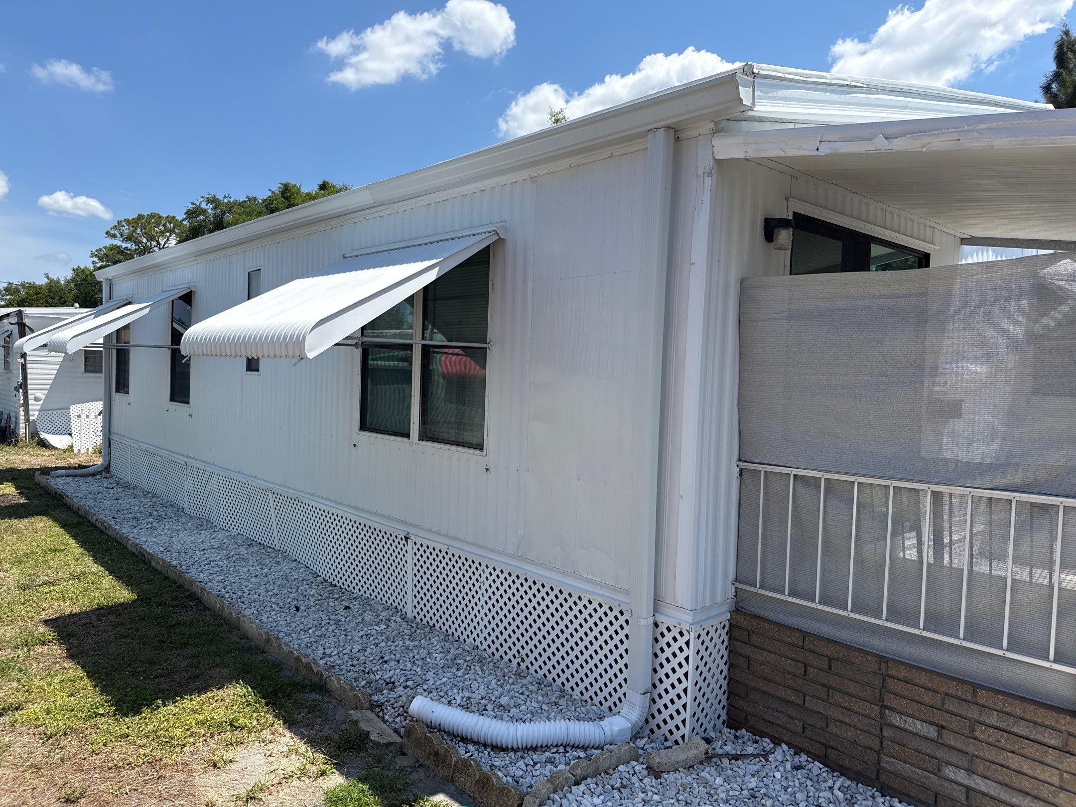 Mobile Home Soft Wash & TPO Roof Cleaning in Plaza Estates – Bradenton, FL by Sunshine AquaWash