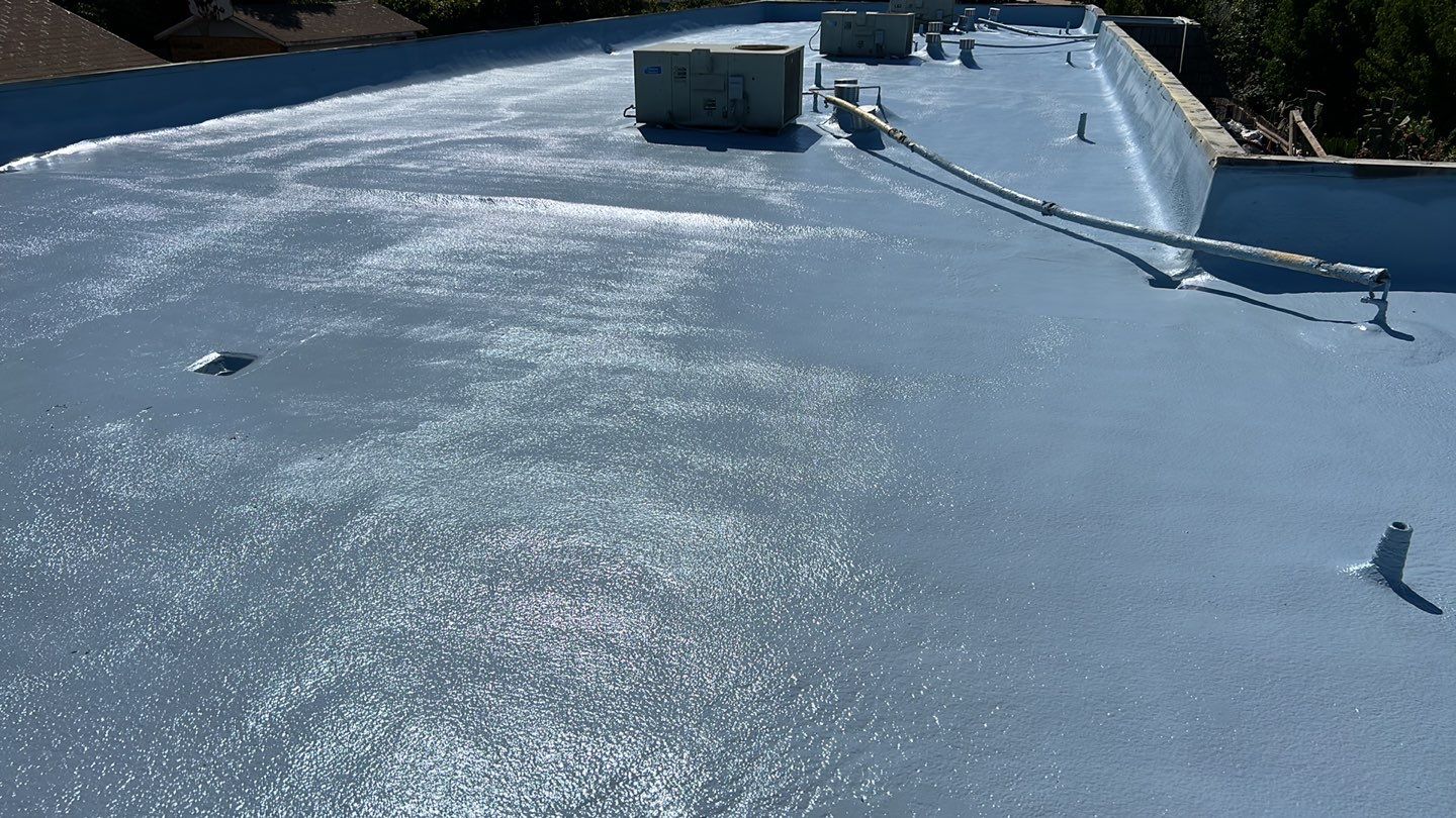 Foam Refurbish using Conklin Benchmark/PUMA XL coatings and spray foam; Also metal roofing around parapet wall by Straight Edge Roofing Inc