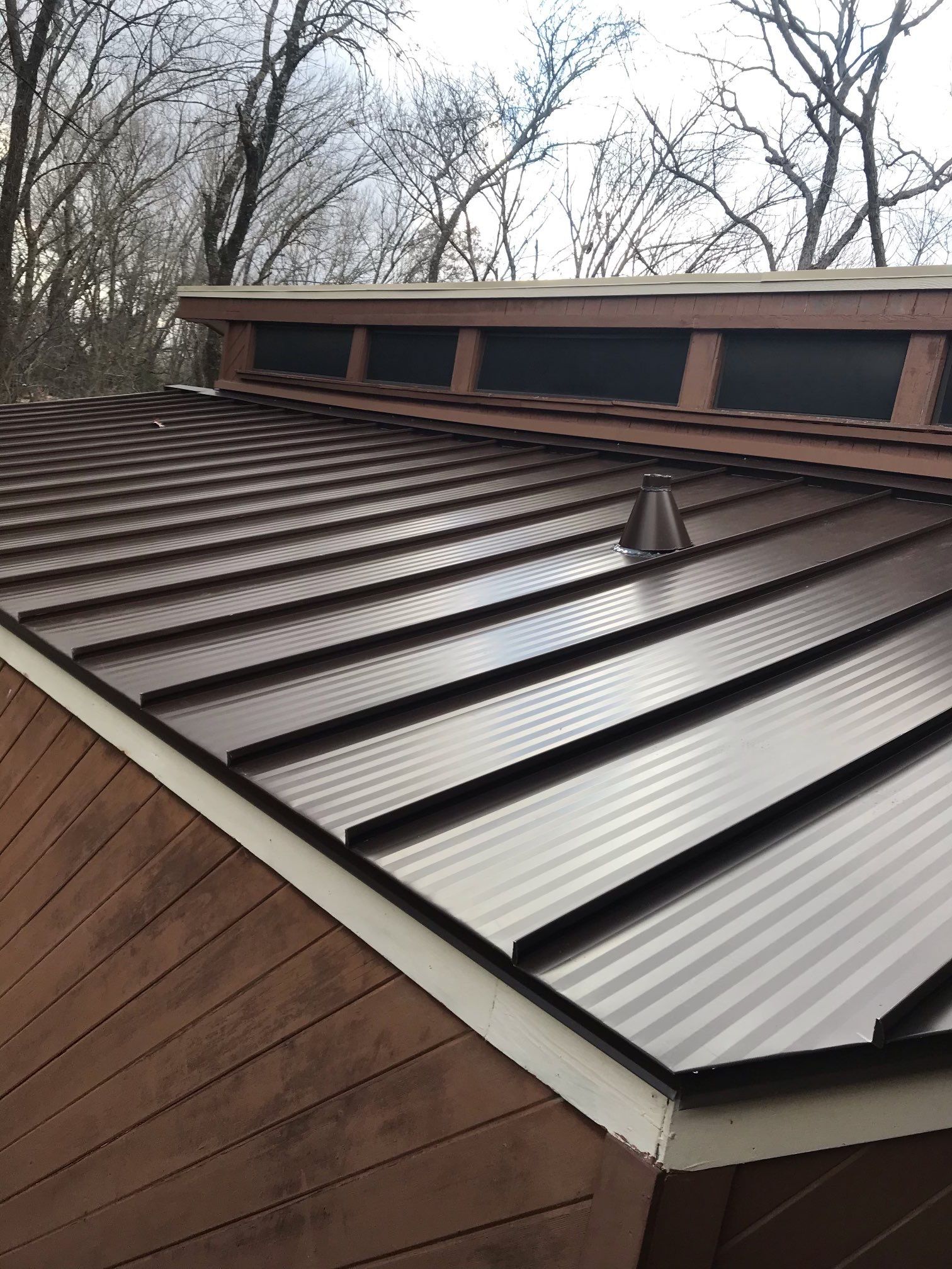 Residential Roofing Installation using Standing Seam Metal Roofing and Composition Shingles by Rainy Day Restoration