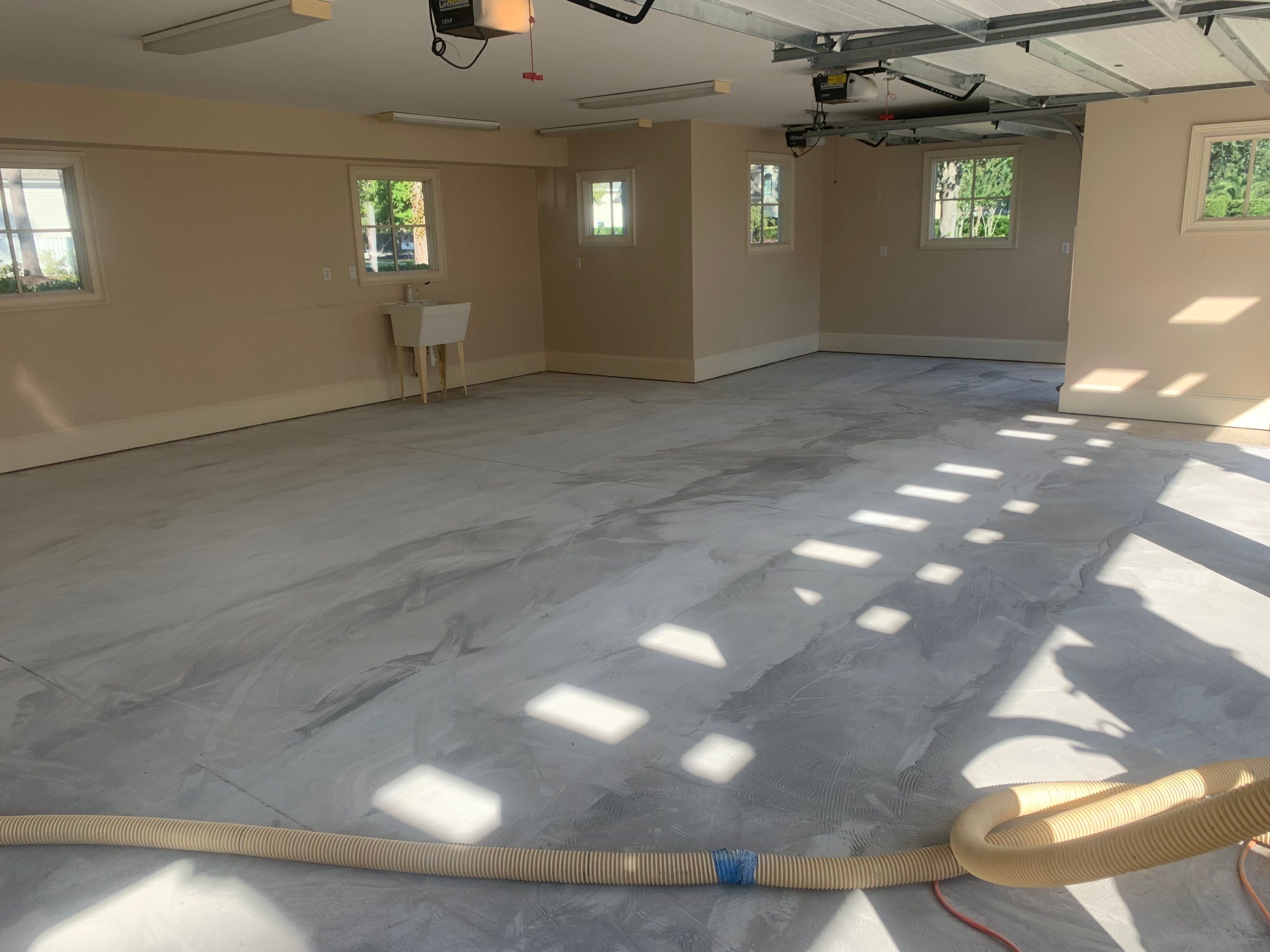 Garage TransFLOORmation using Sandstone by Innovative Concrete Coatings 
