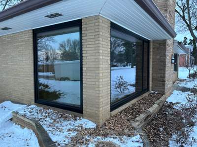 Black-Frame Pella Lifestyle Upgrade on a Partial Brick Home