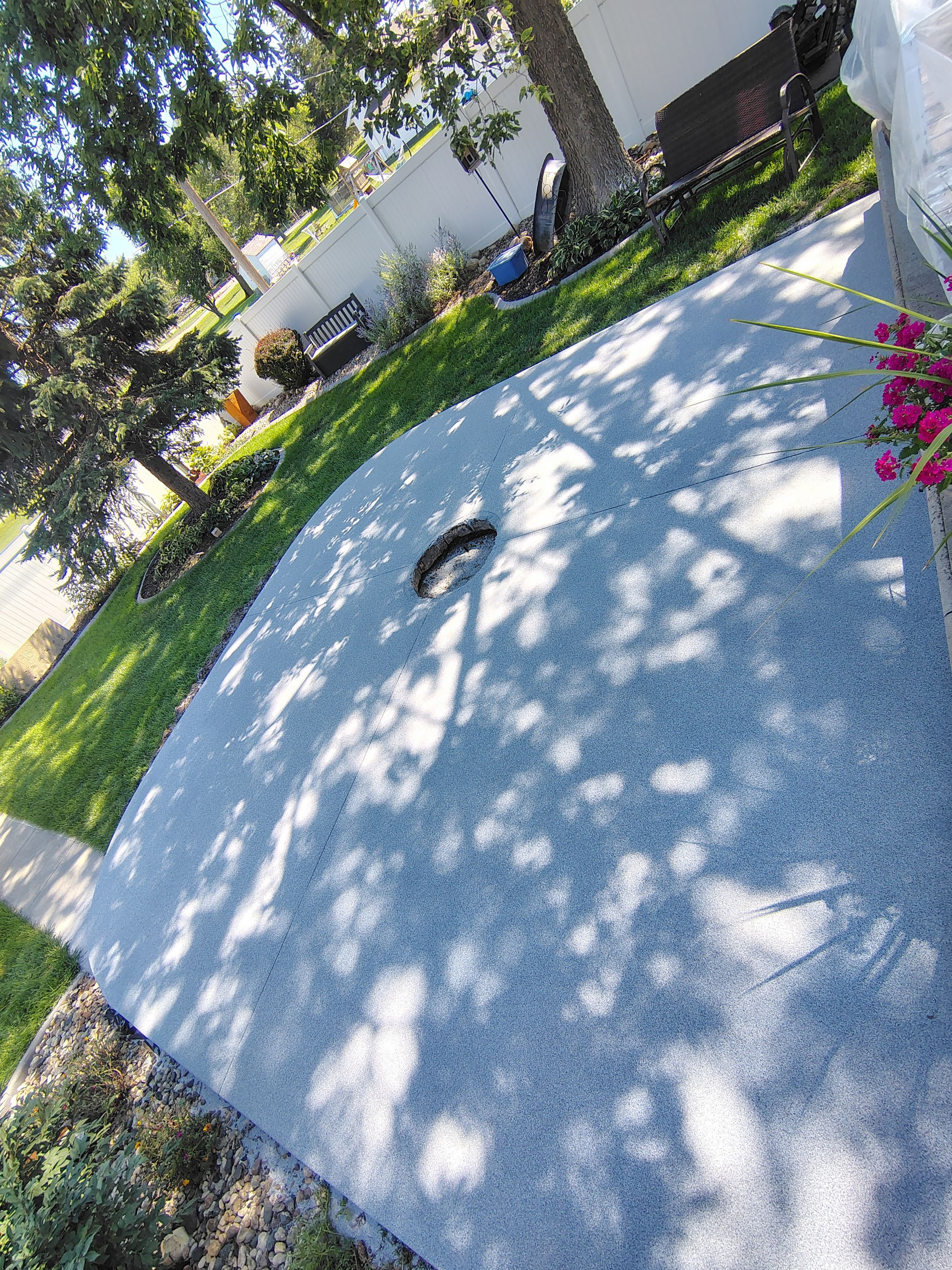 Custom Garage Floor Coating and Backyard Patio Refinishing in Tyndall by Select Painting, Coatings & Garage Cabinets