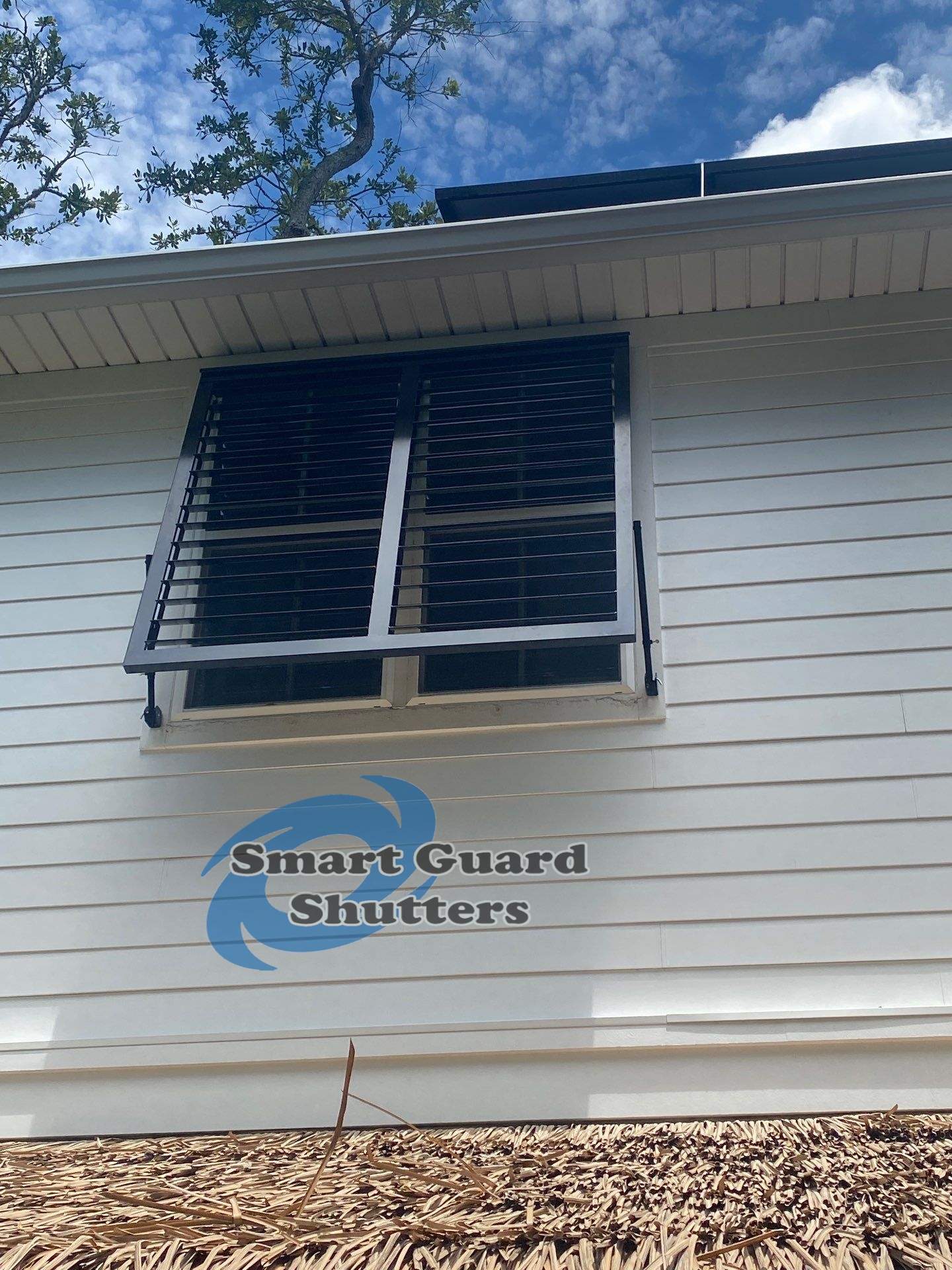 Impact Bahama Shutters in Jet Black by Smart Guard Shutters