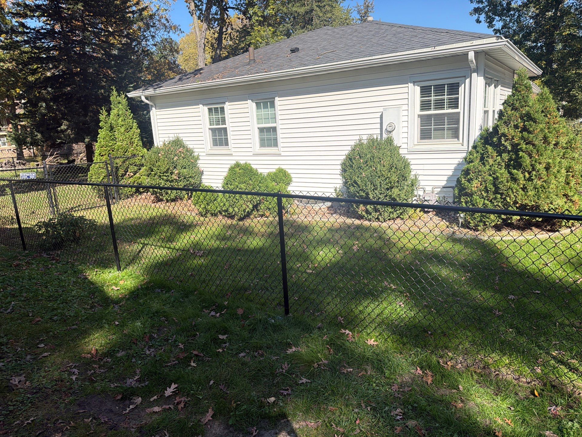 Residential Black Chain Link Fencing in Cedar Falls by Perfect Picket Fence and Stain
