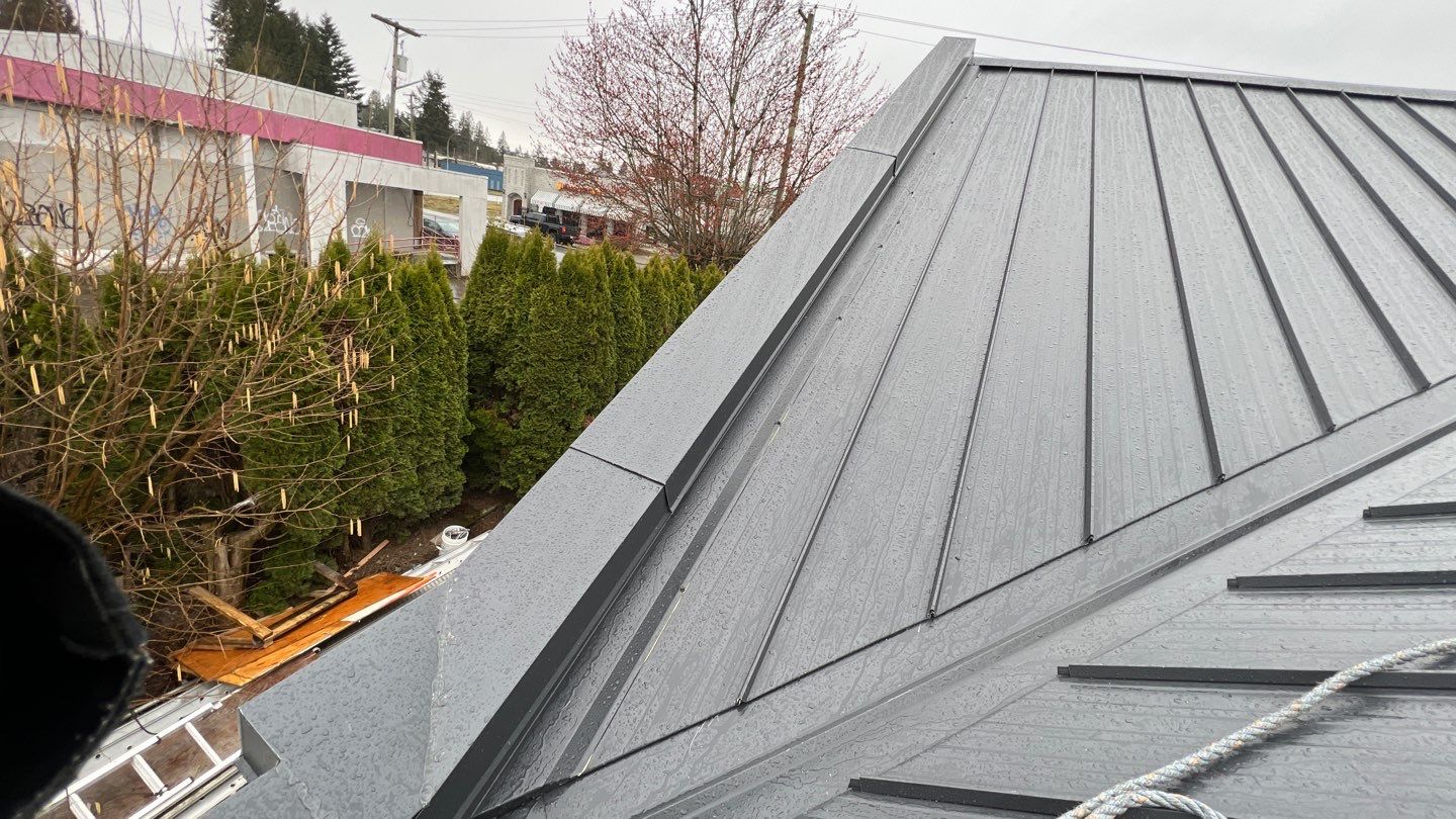 Commercial Roofing Installation using 12" Prolok metal and hidden gutters! by Top Notch Roofing Inc