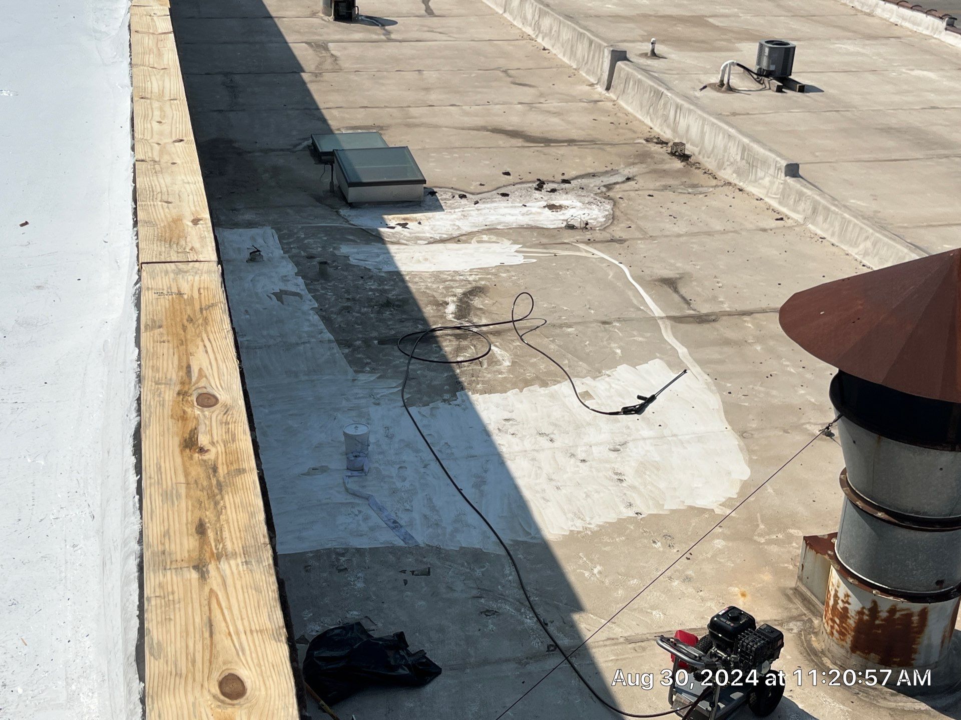 Commercial Roofing Installation using smartcoat Roof coating by Fahey Roofing + Contracting
