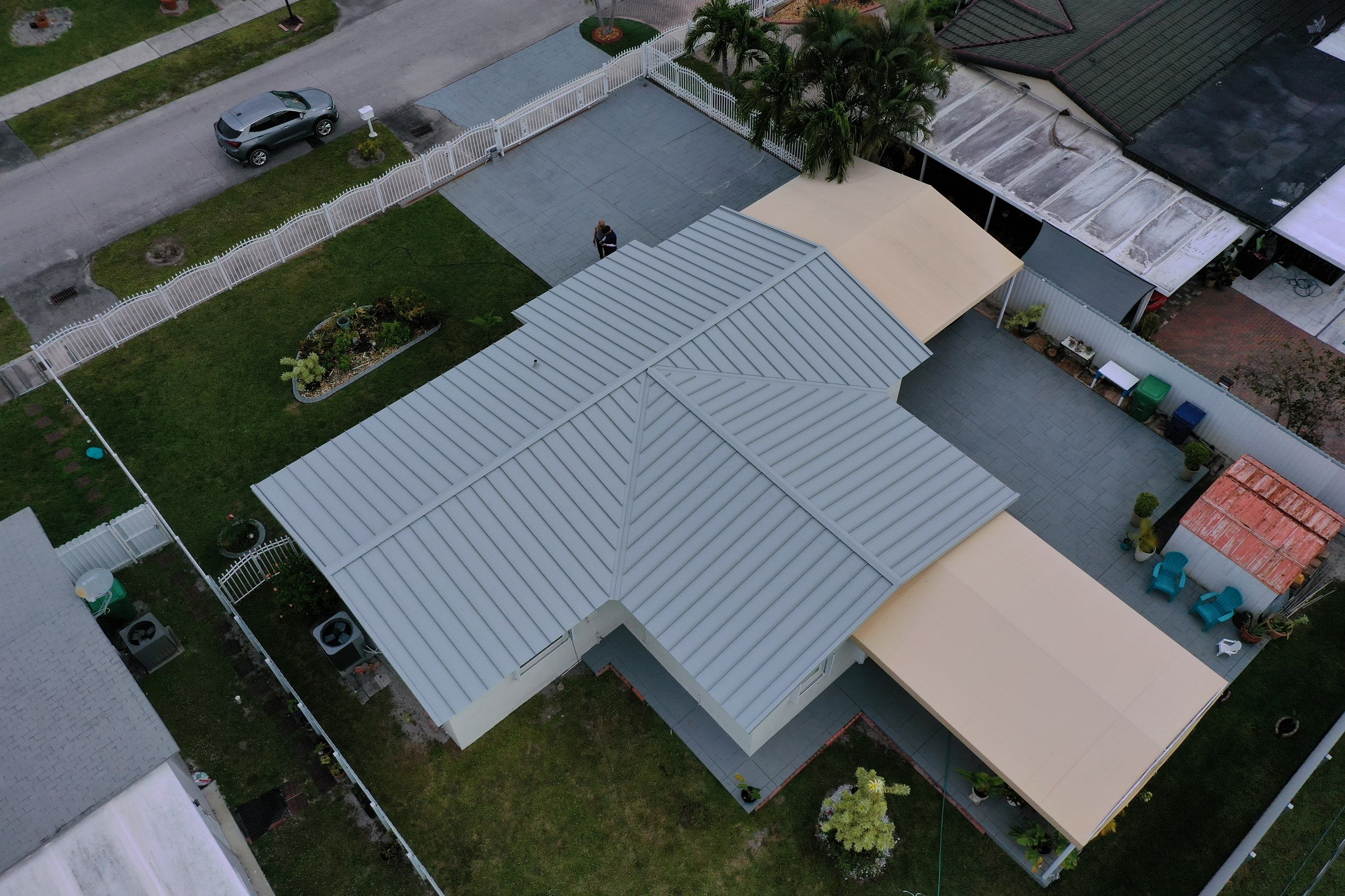 RESIDENTAL METAL REROOF 24 GUAGE DOVE GRAY 1-1/2" MECHANICAL SEAM METAL POLYGLASS POLYSTICK XFR by Earl W. Johnston Roofing 