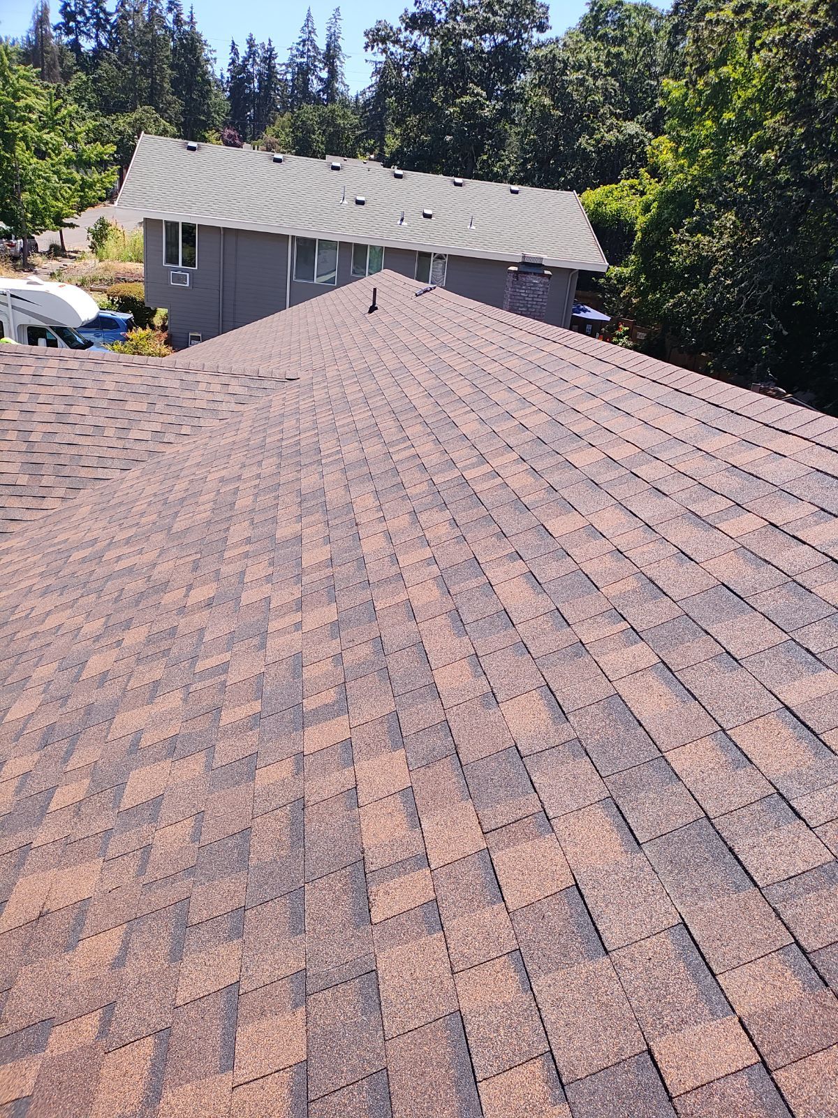 Residential Reroof using Owens Corning Duration Shingles in the color Brownwood. by BEST Roofing & Waterproofing