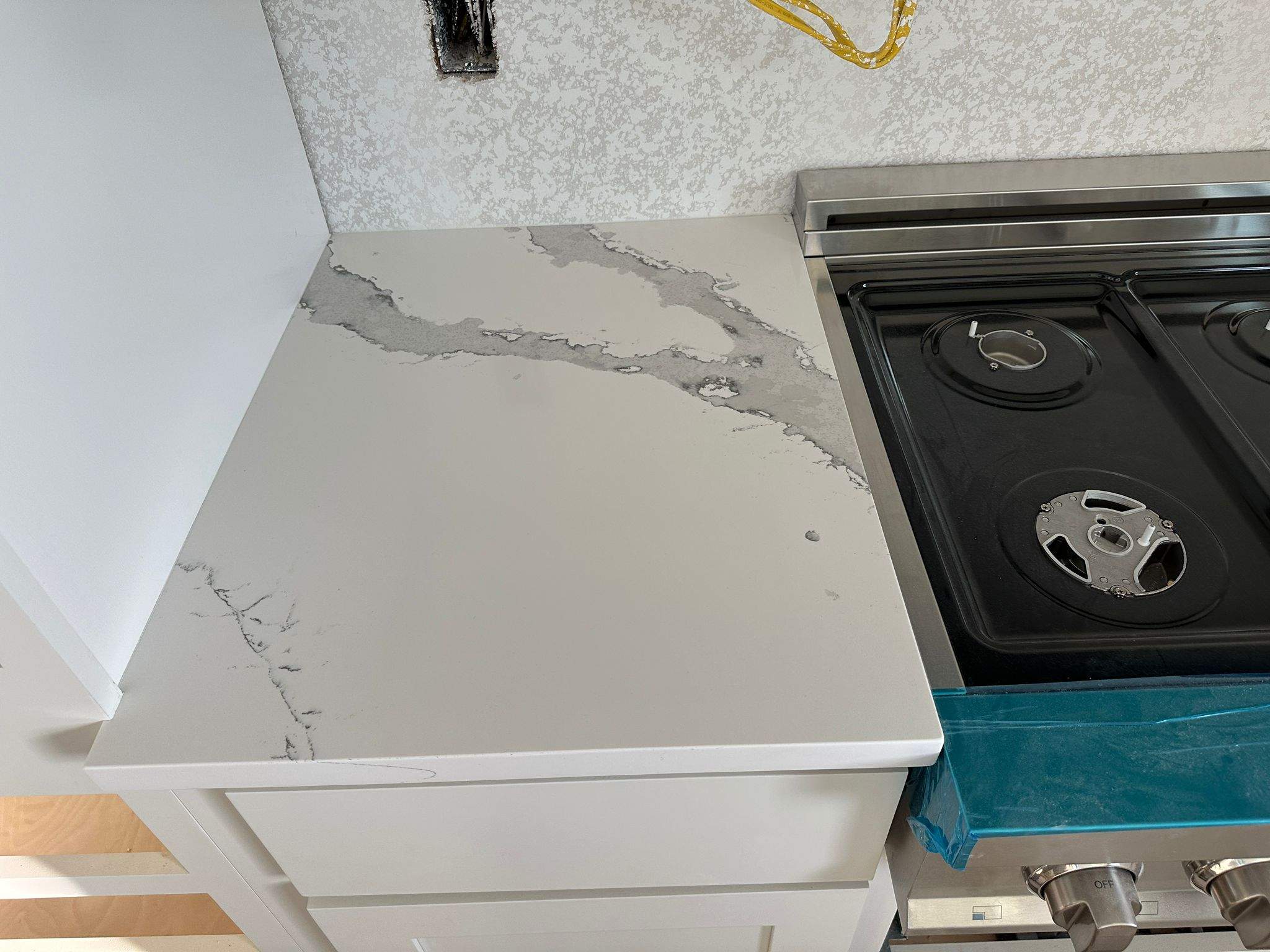 Kitchen and Bathroom Countertop Upgrades Featuring Gray Veined Quartz by Mena stone surfaces