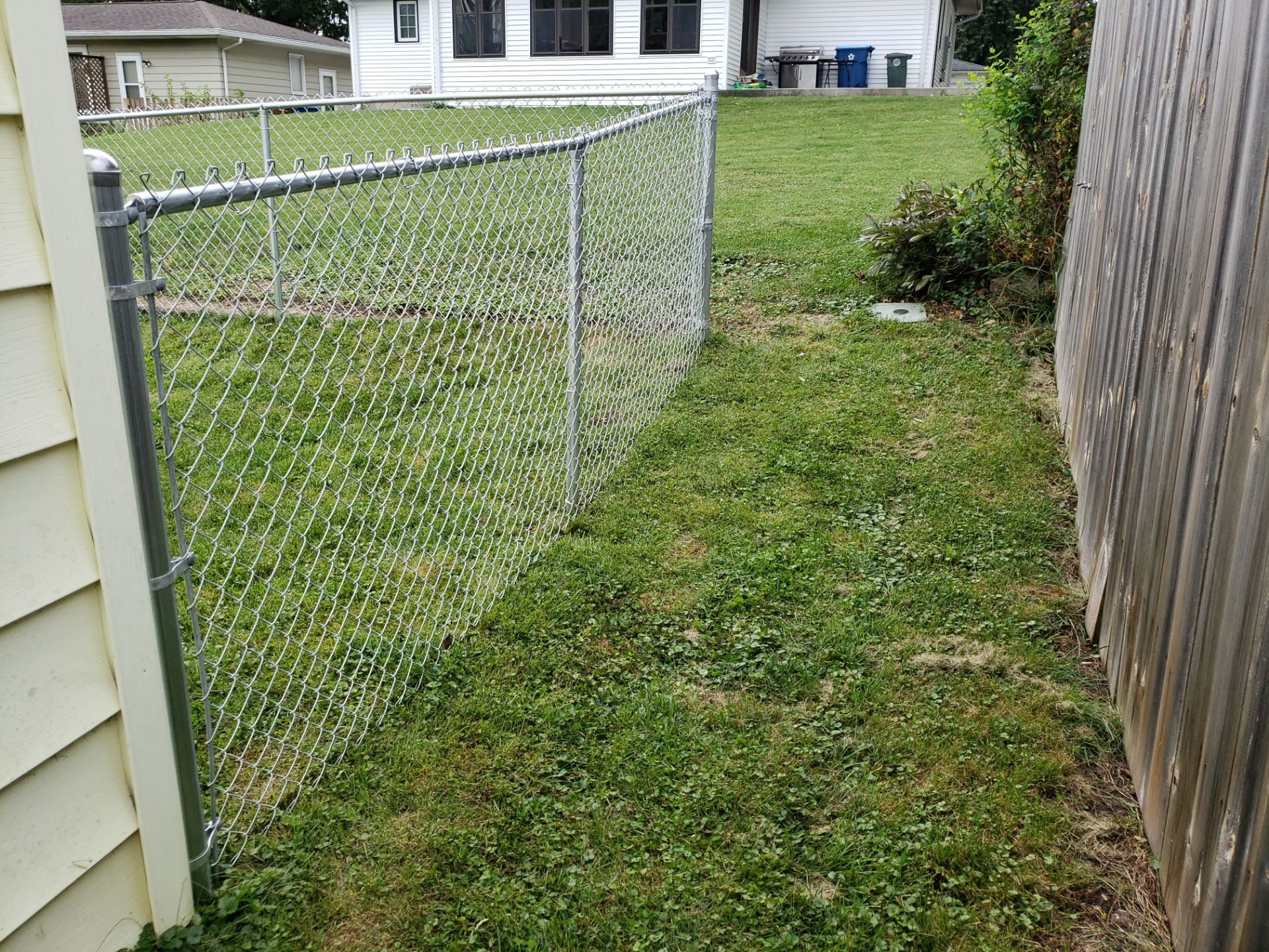 Residential Chain Link Fence and Gate Installation in Waterloo by Perfect Picket Fence and Stain