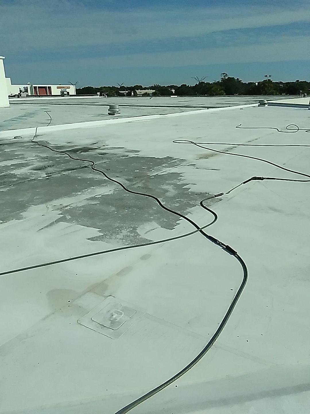 Silicone Roof Coating and Parapet Wall Repairs in South Bradenton by CES Roofing