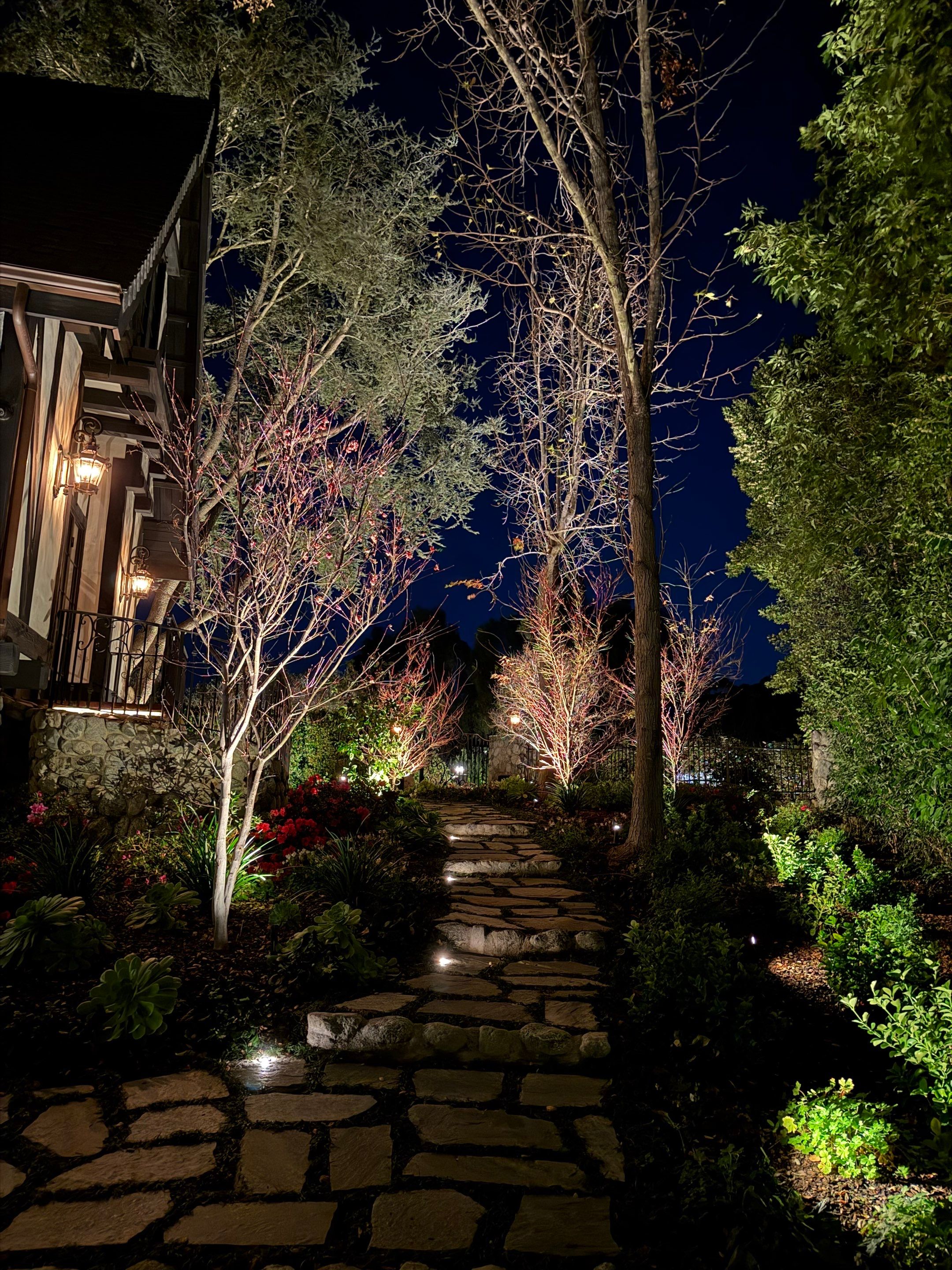 Tudor Estate Landscape Lighting with Integrated Stone Step Illumination by Outdoor Lights + Shades