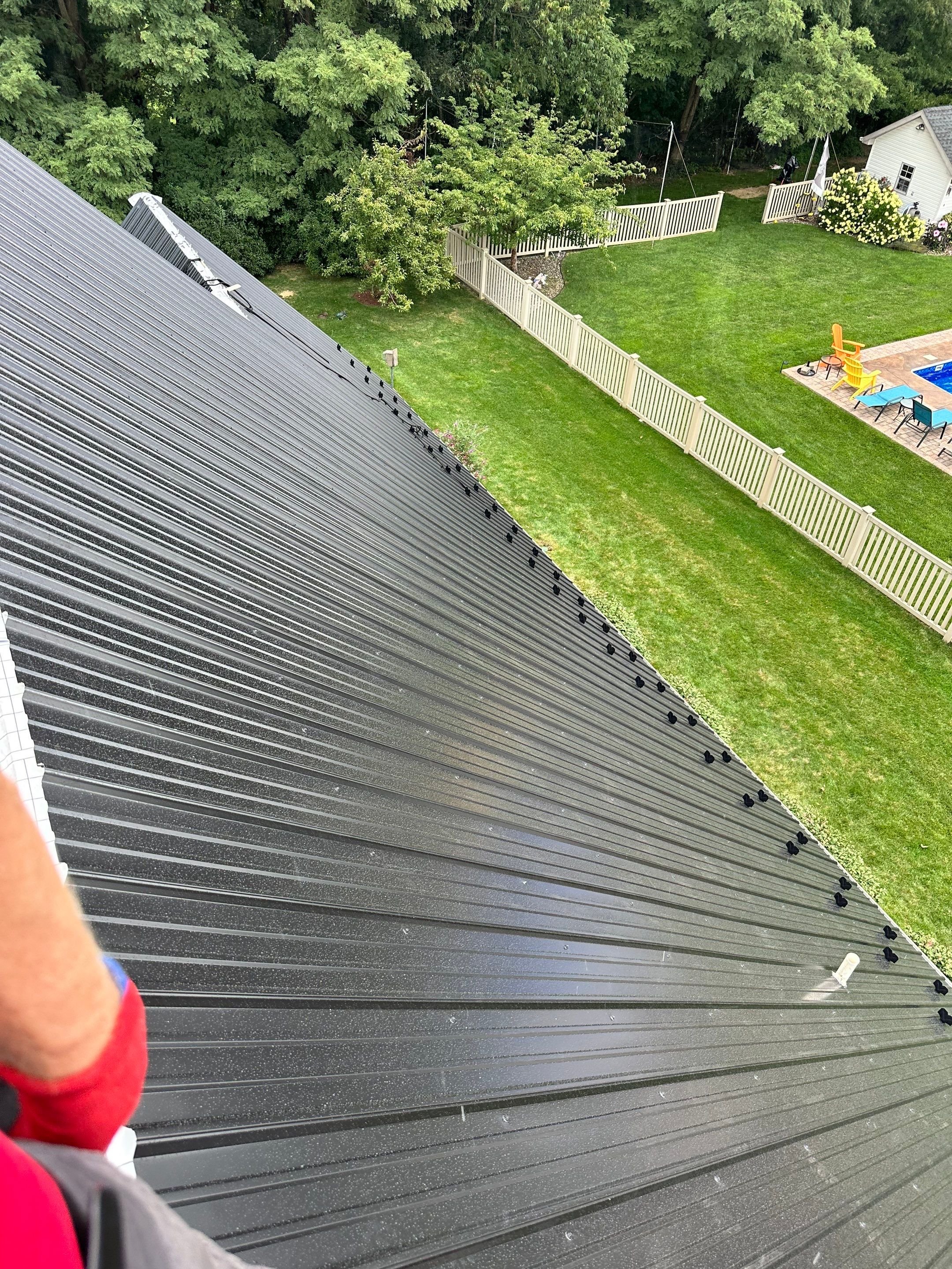 Standing seam / Azm panel in black  by Teflon Roofing