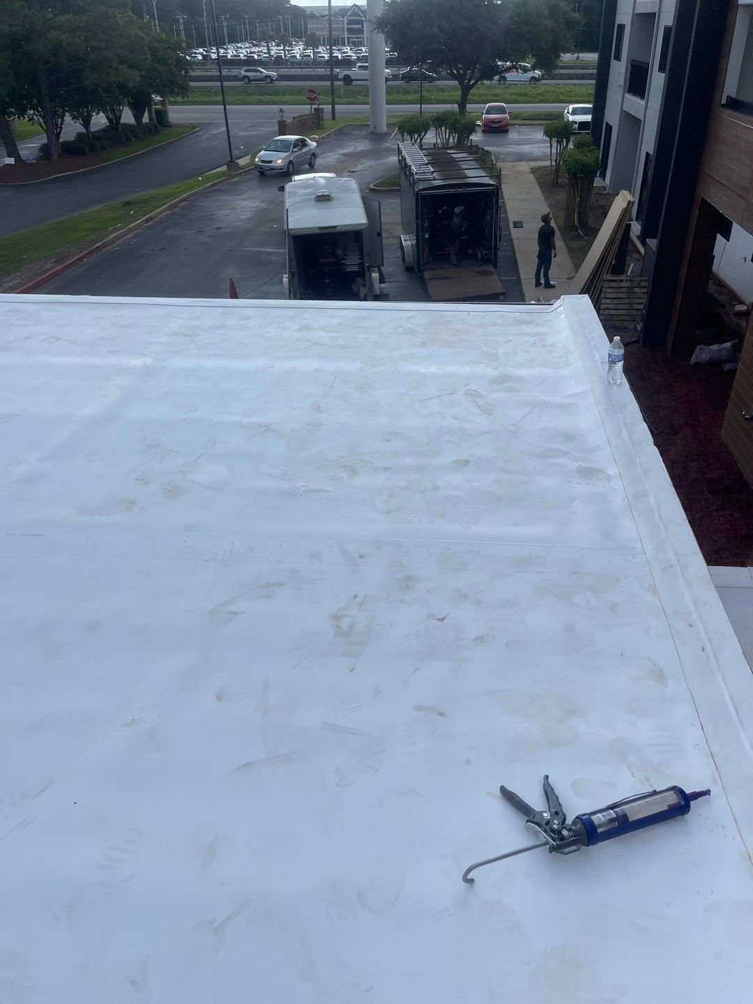 Commercial Roofing Installation using Roof Replacement by American Roofing & Construction LLC