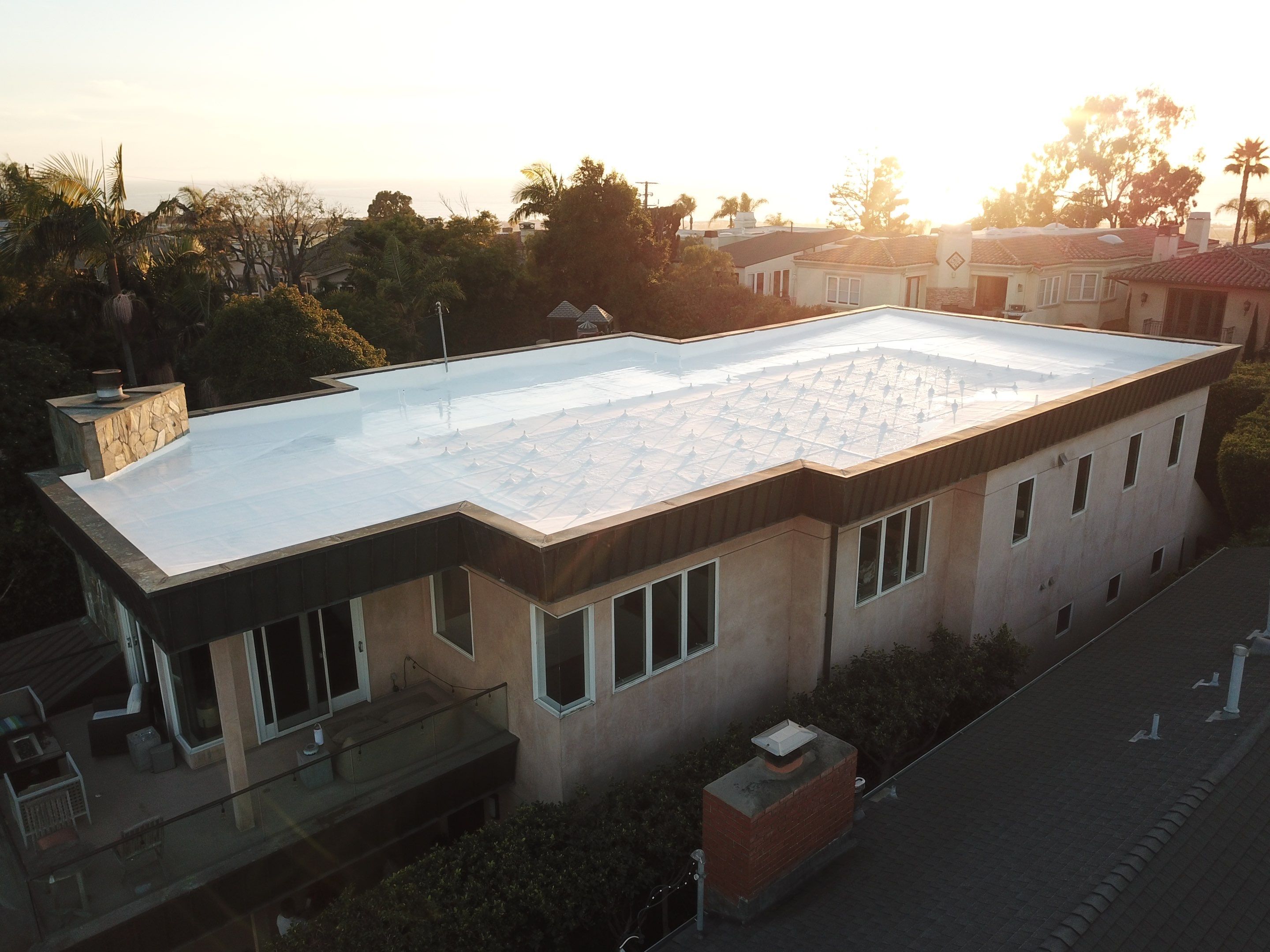Residential Roofing Installation using ASC Silicone Membrane by Hull Brothers Roofing