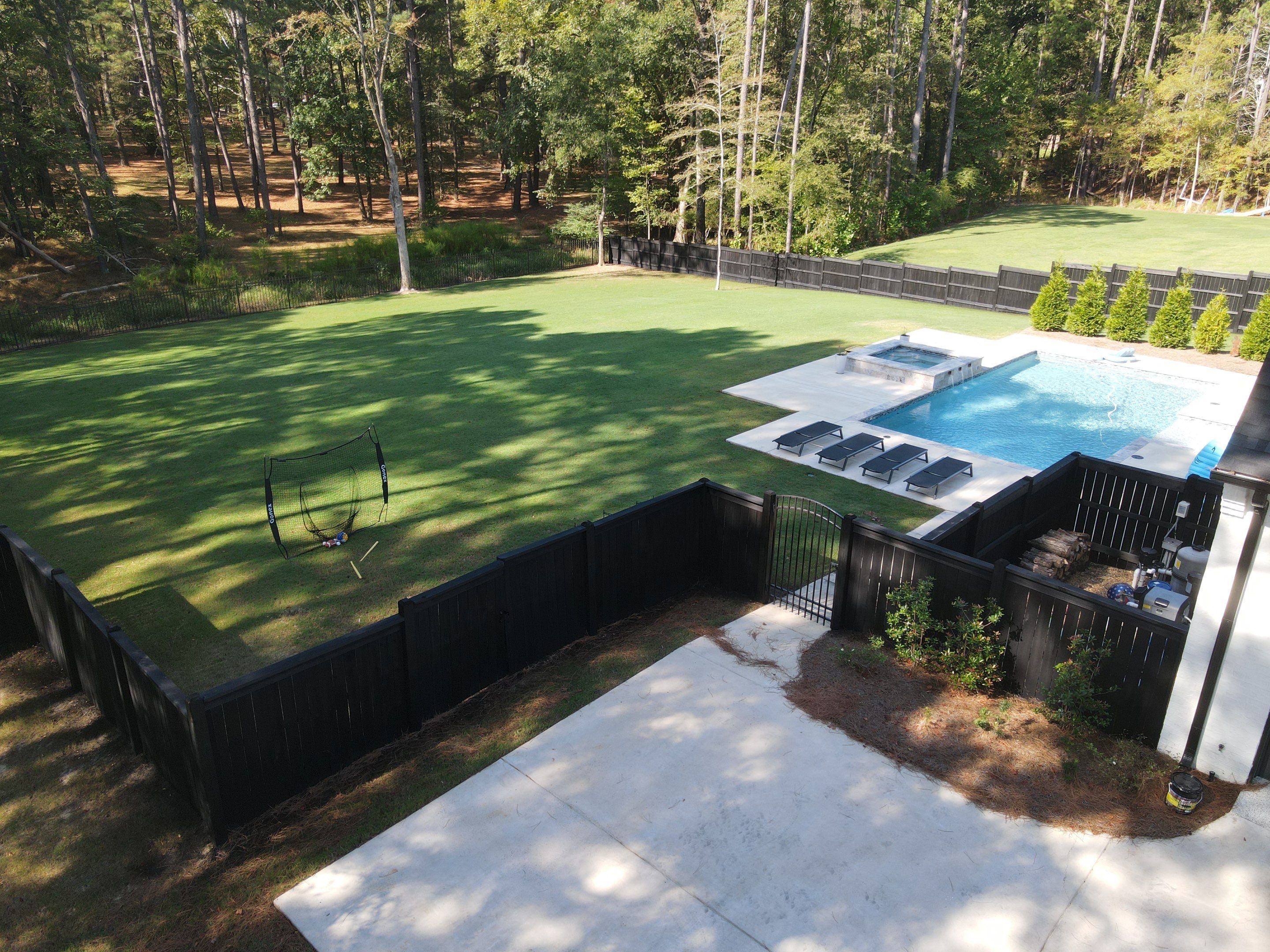 Fence Stain using Wood Defender Black  by Roberson Construction LLC