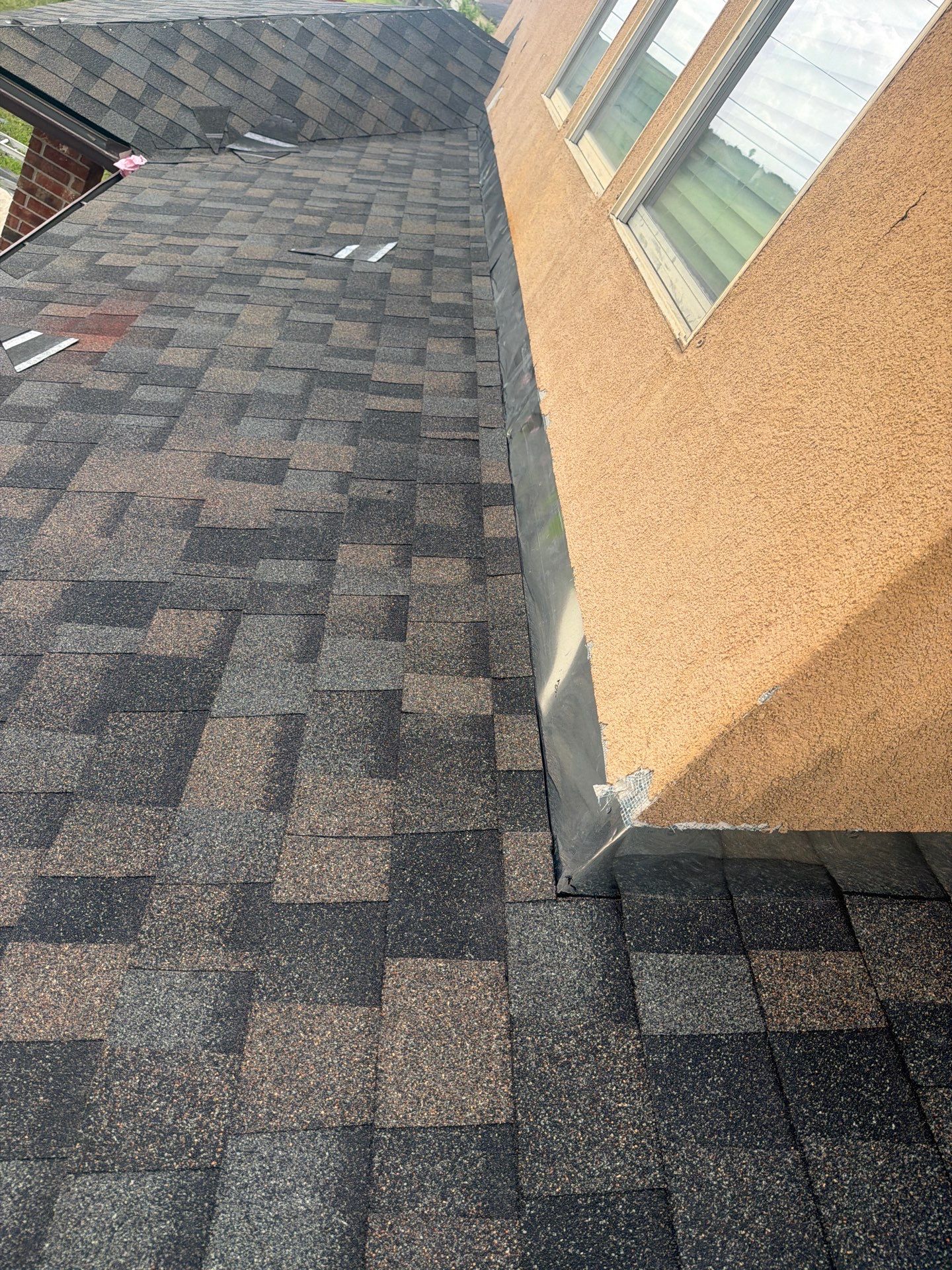 Flashing Stucco above the Roof by Bayfront Roofing and Construction