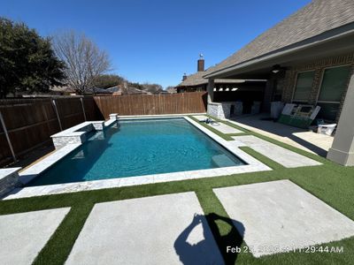 Geometric Pool with Raised Water Feature Wall and Turf