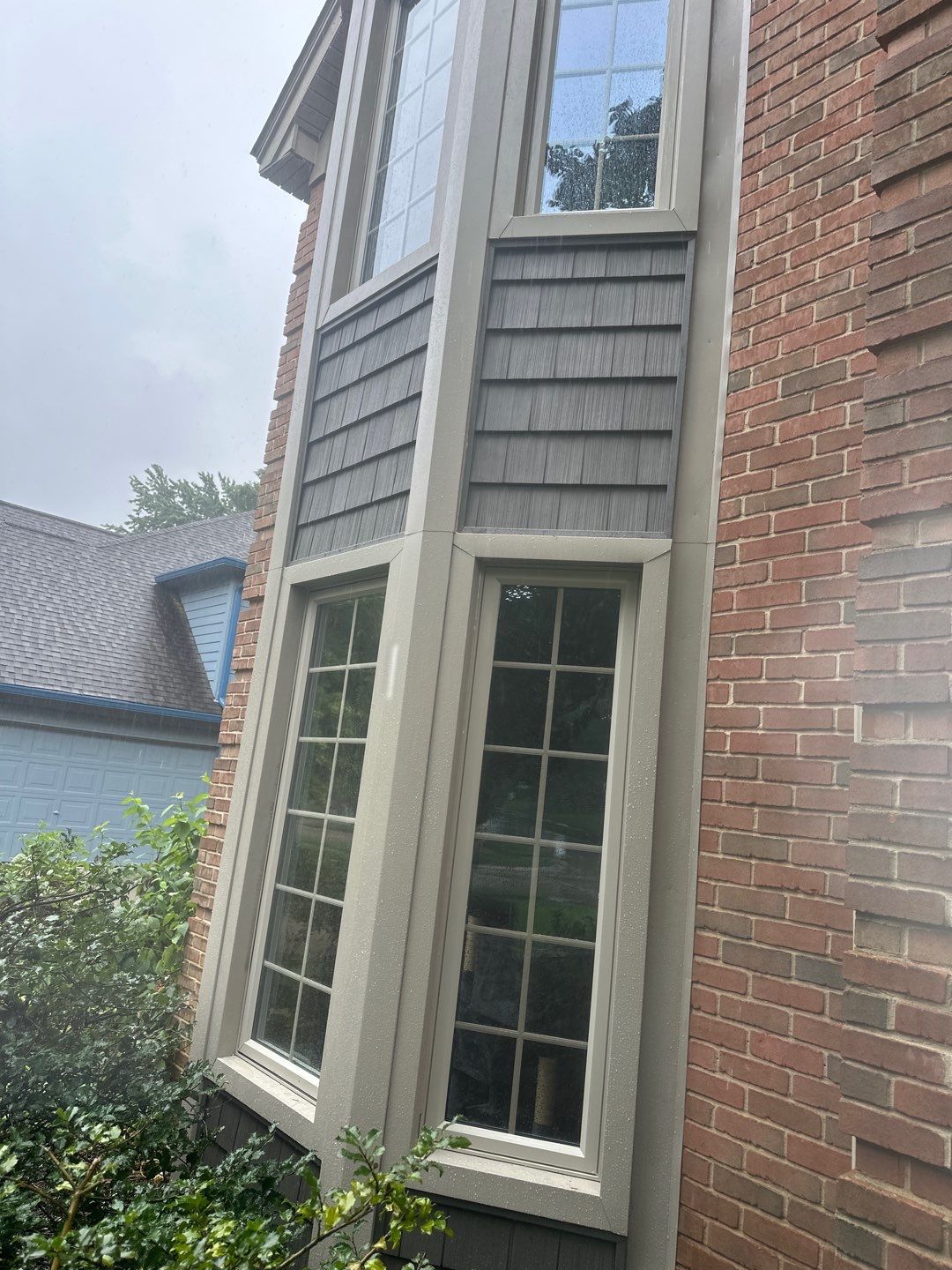 Roof Replacement using Owens Corning Peppercorn and Siding Replacement using Ascend Charcoal Smoke by 180 Contractors