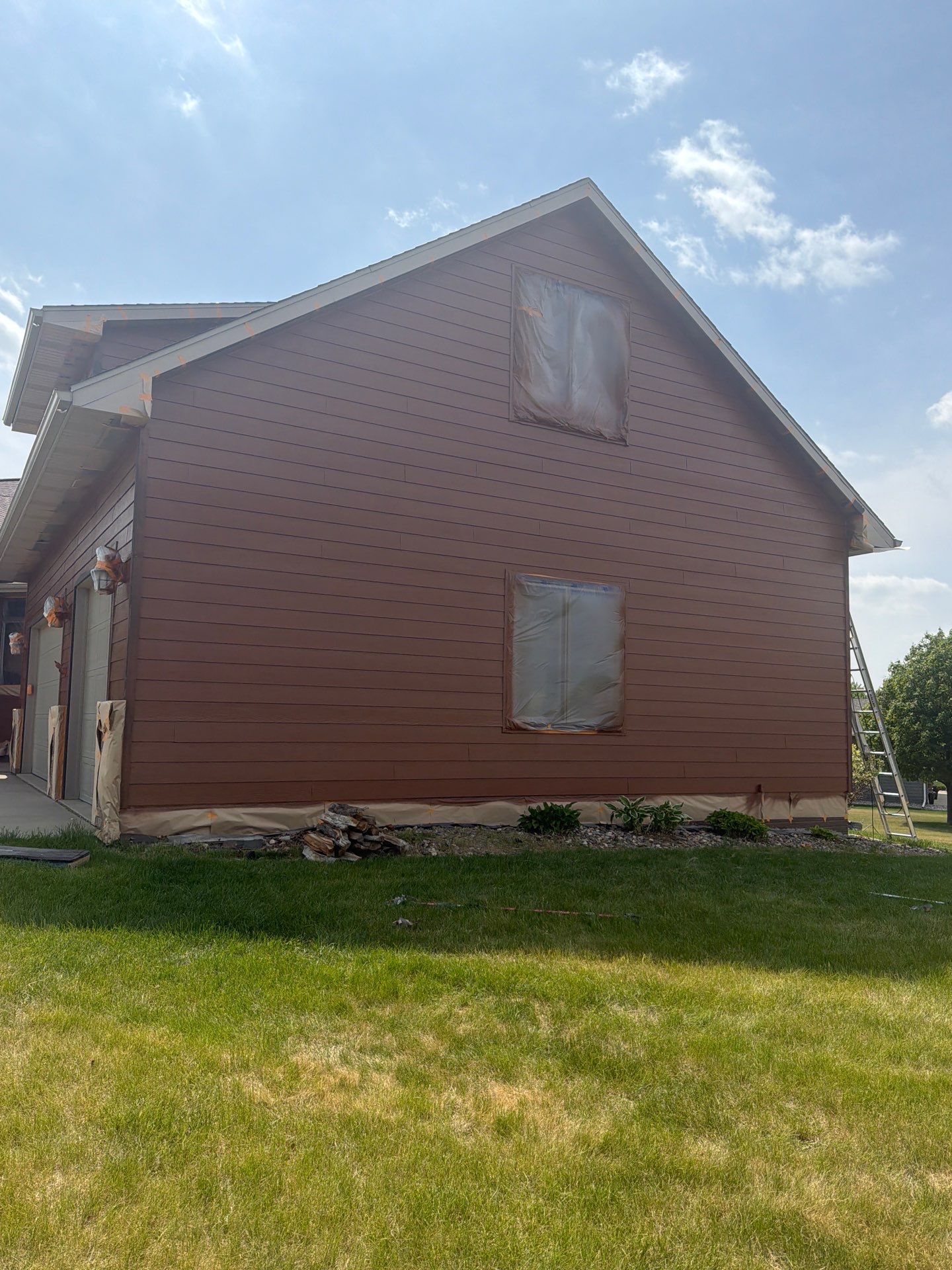 Residential Exterior Painting and Siding Restoration in Crooks by Select Painting, Coatings & Garage Cabinets