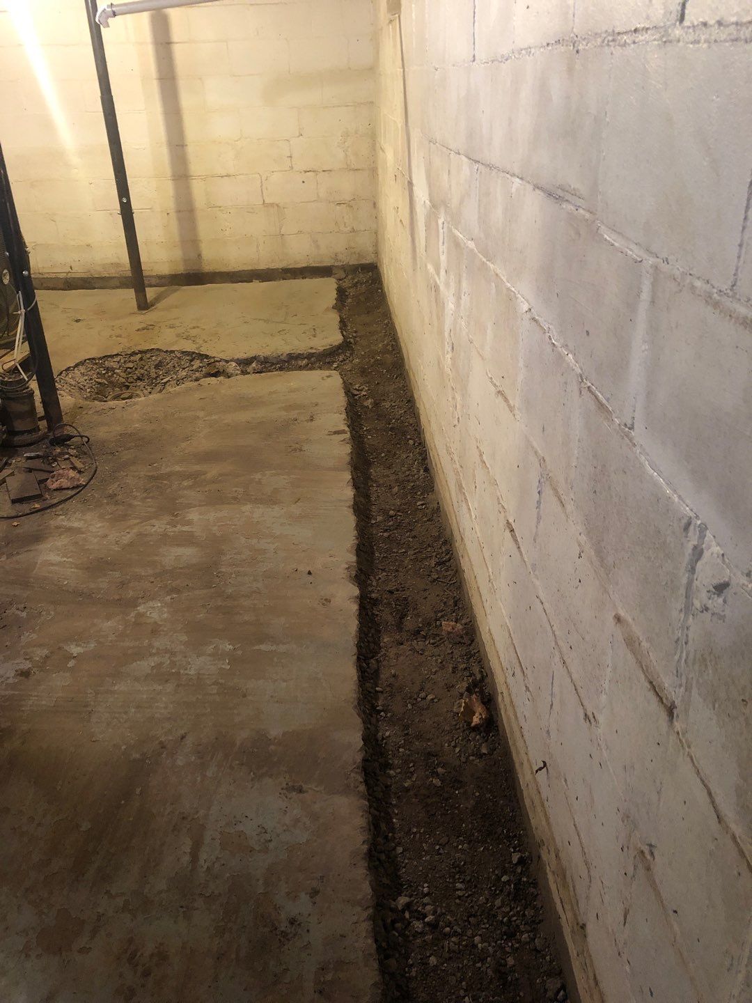 Basement Waterproofing using Drain tile system and a foundation wrap by ACE Waterproofing & Basement Solutions