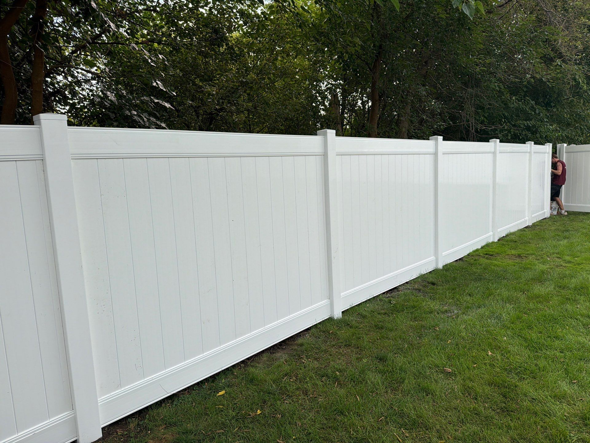 White Vinyl Privacy Fence Installation in Raymond, IA by Perfect Picket Fence and Stain