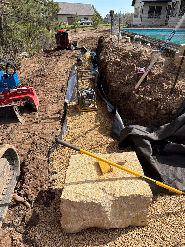 Limestone Boulder Wall by Sota landscaping