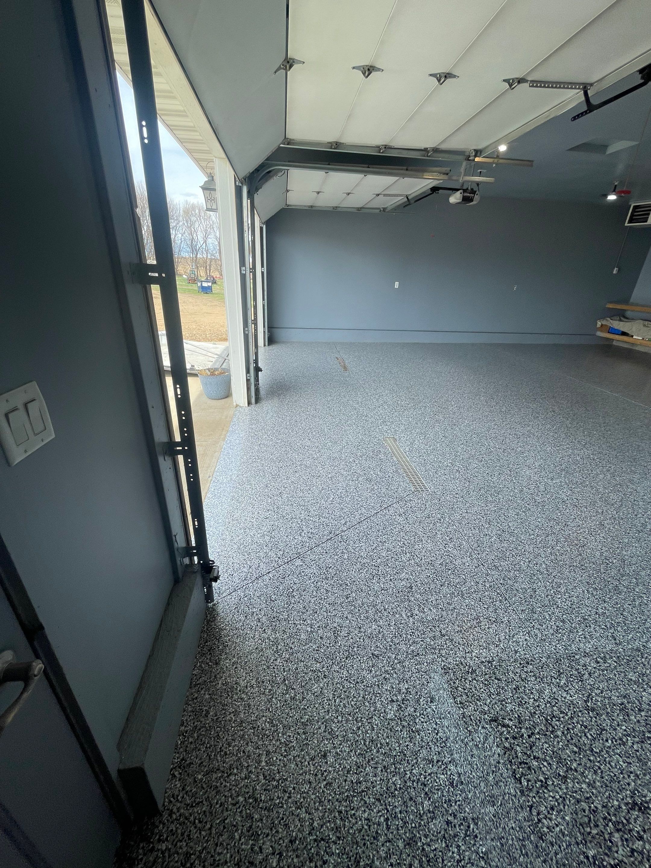 Grey Granite-Style Garage Floor Coating and Stairs in Hartford by Select Painting, Coatings & Garage Cabinets