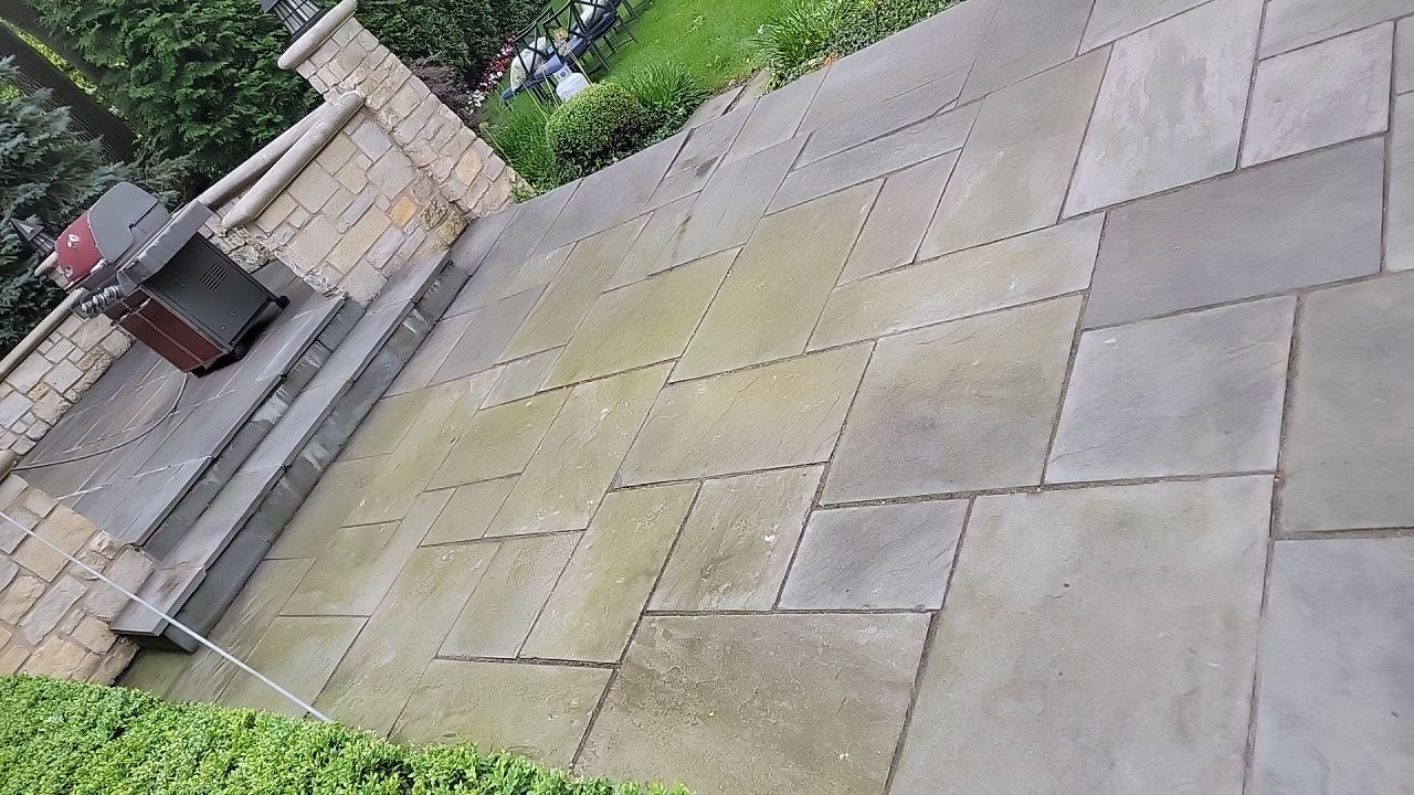 Northbrook, IL stucco home soft wash and stone cleaning by Northern Power Washing LLC.