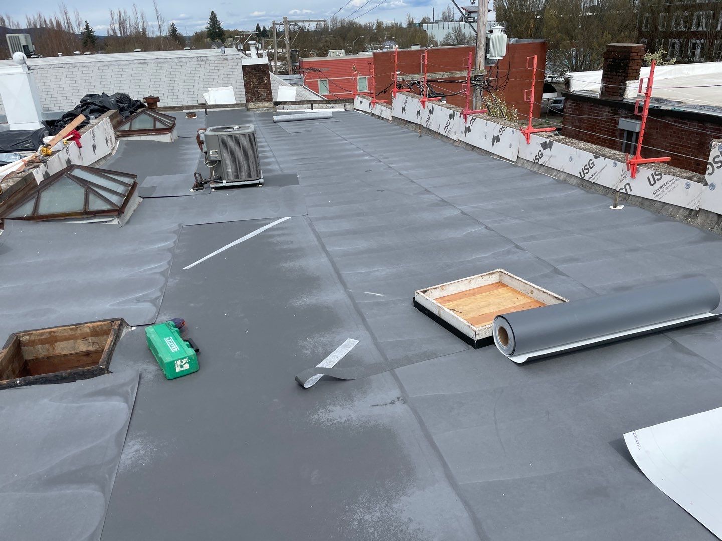 Commercial Flat Roof Installation using GAF 60Mil TPO  by Orezona Building & Roofing Company, Inc.