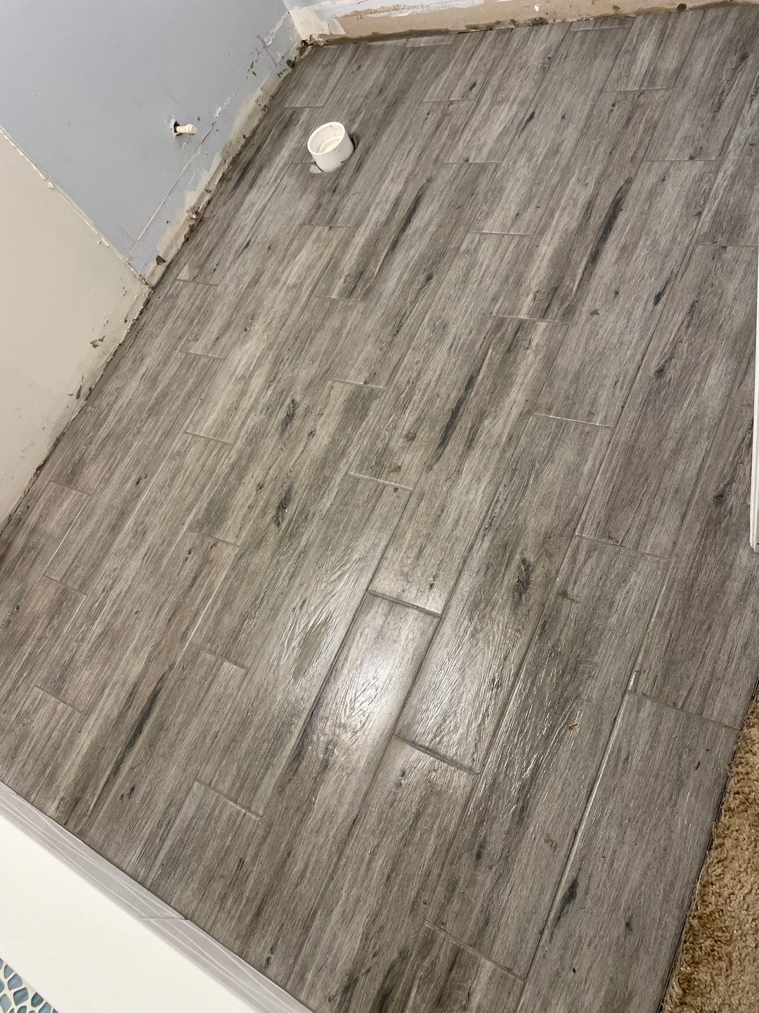 Sleek bathroom shower remodel by Footprints Floors of East Atlanta