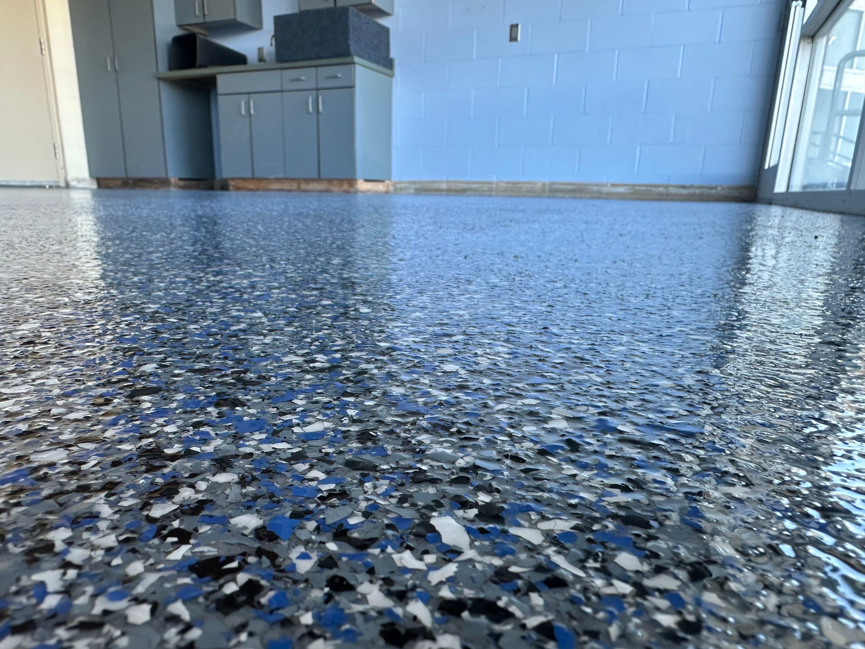 Commercial Epoxy Floor Coating for Stadium Viewing Suites in Sioux Falls by Select Painting, Coatings & Garage Cabinets