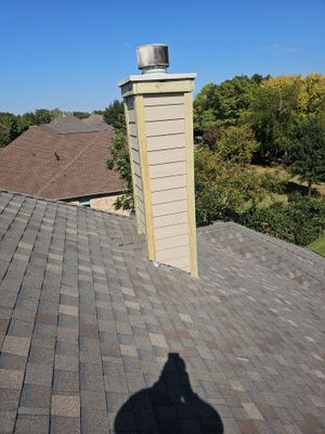 chimney repair using lap engineered treated composite siding.