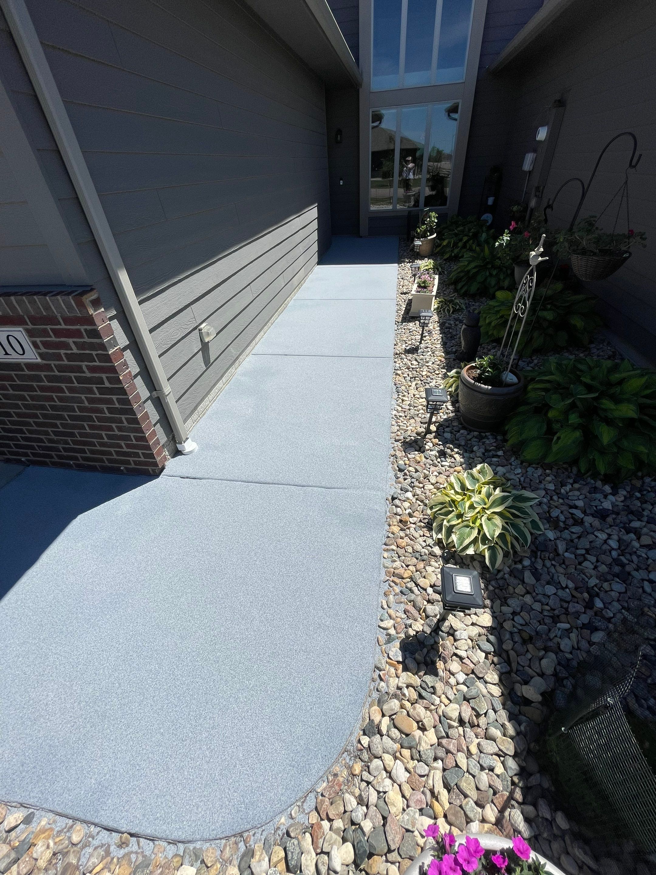 Custom Concrete Coating for Sioux Falls Patio and Front Walkway by Select Painting, Coatings & Garage Cabinets