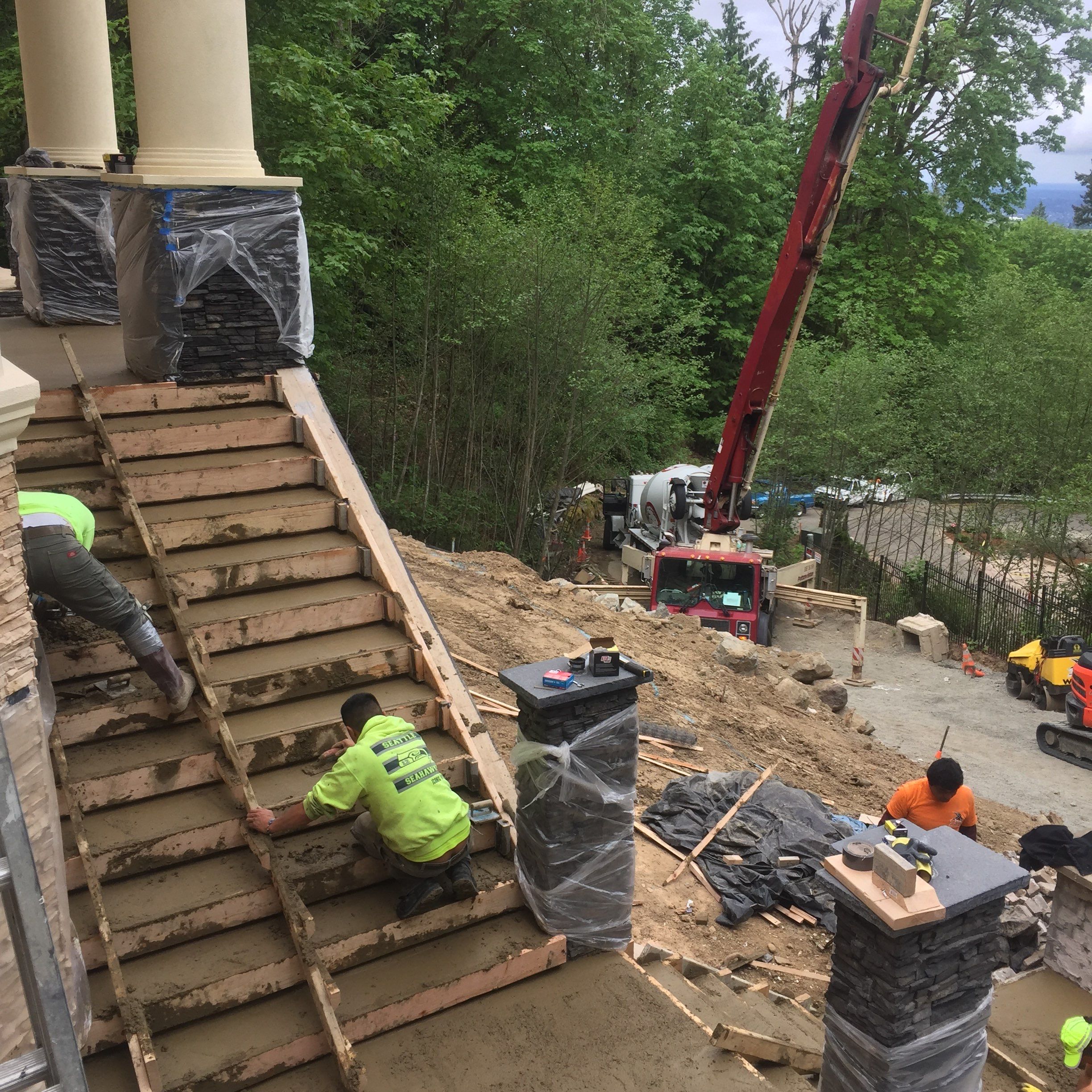 Asphalt Driveway and Stamped Concrete Patio Finish  by Jireh Asphalt & Concrete Inc 