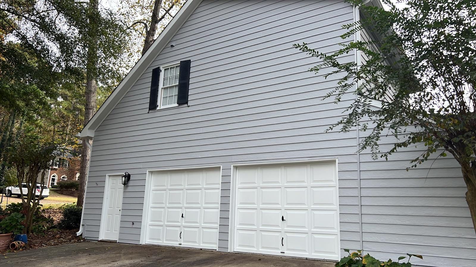Full Exterior Home and Detached Garage Painting in Kennesaw by Swift Home Renovations 