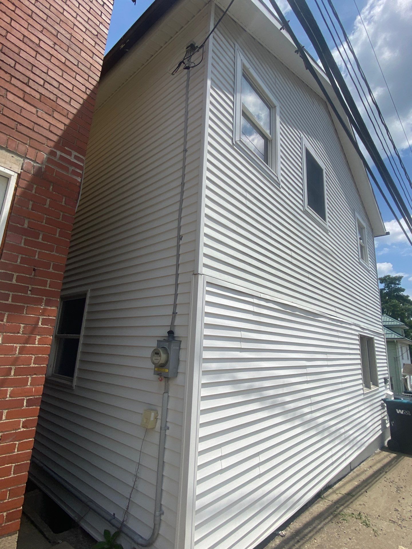 White siding  by Cousins Roofing Siding & Decks
