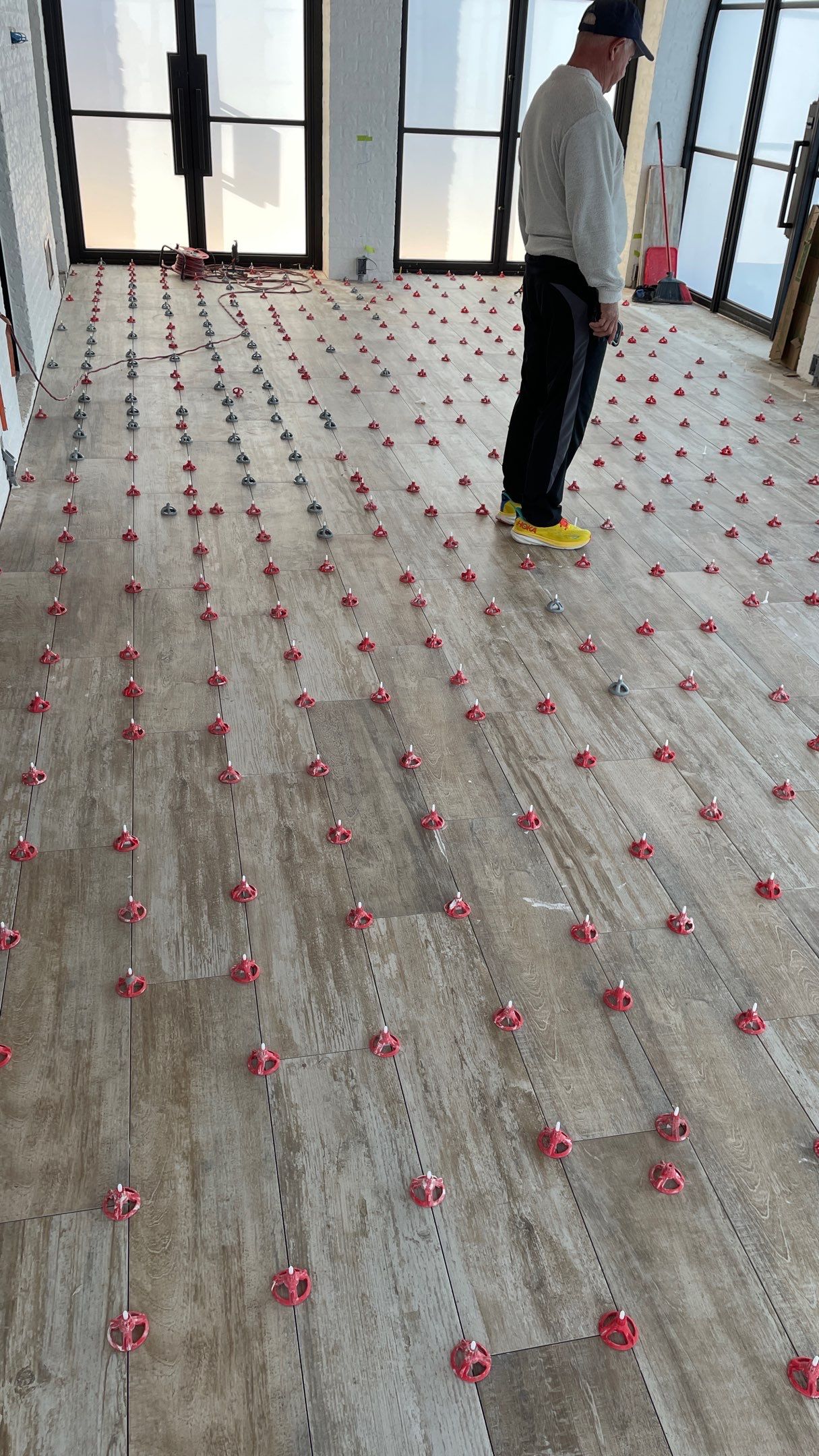 Instant Transformation of this Beautiful Sunroom by Footprints Floors of Coastal Carolina