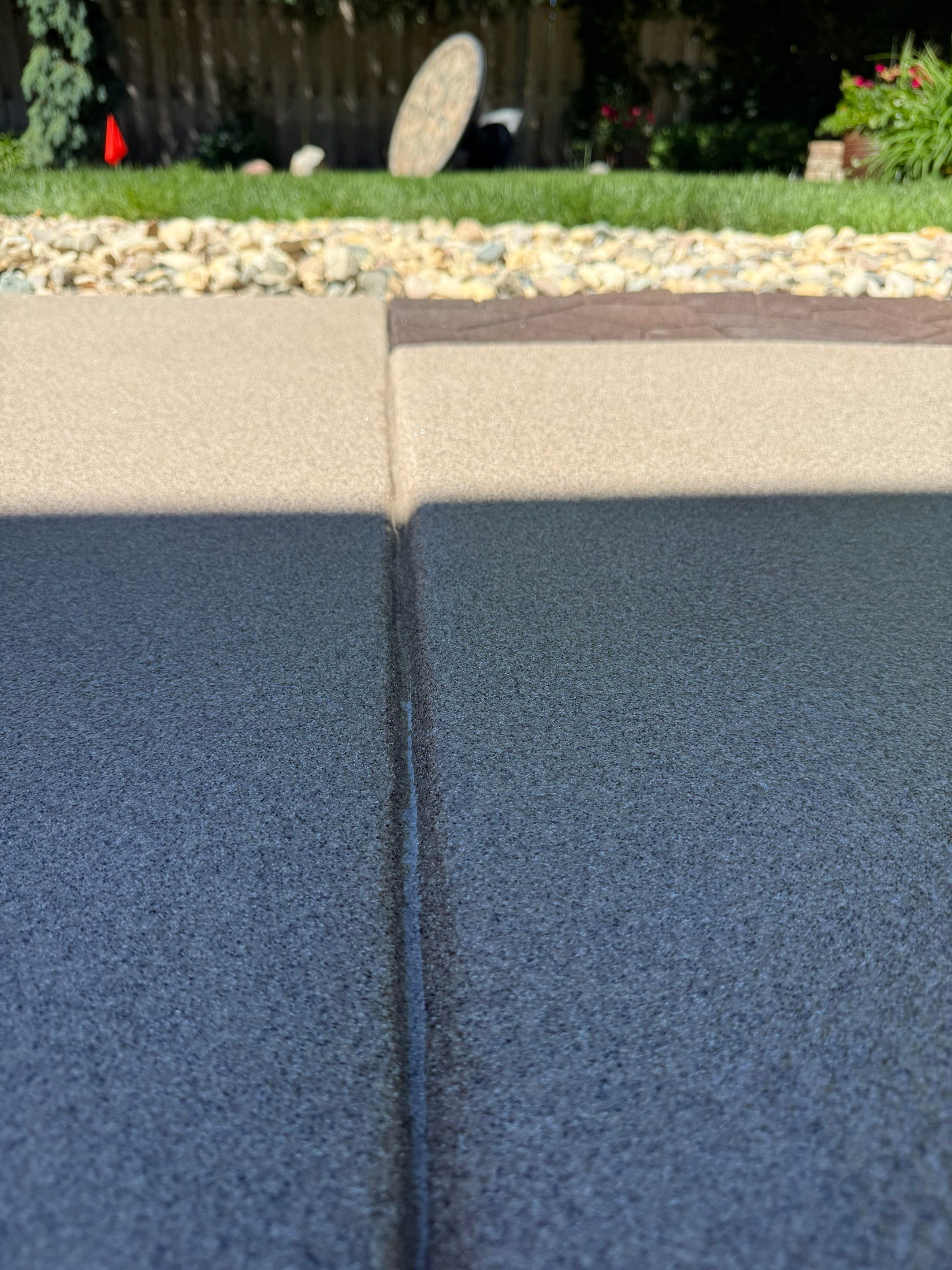 Textured Concrete Coating and Paver Patio Refresh in Sioux Falls by Select Painting, Coatings & Garage Cabinets