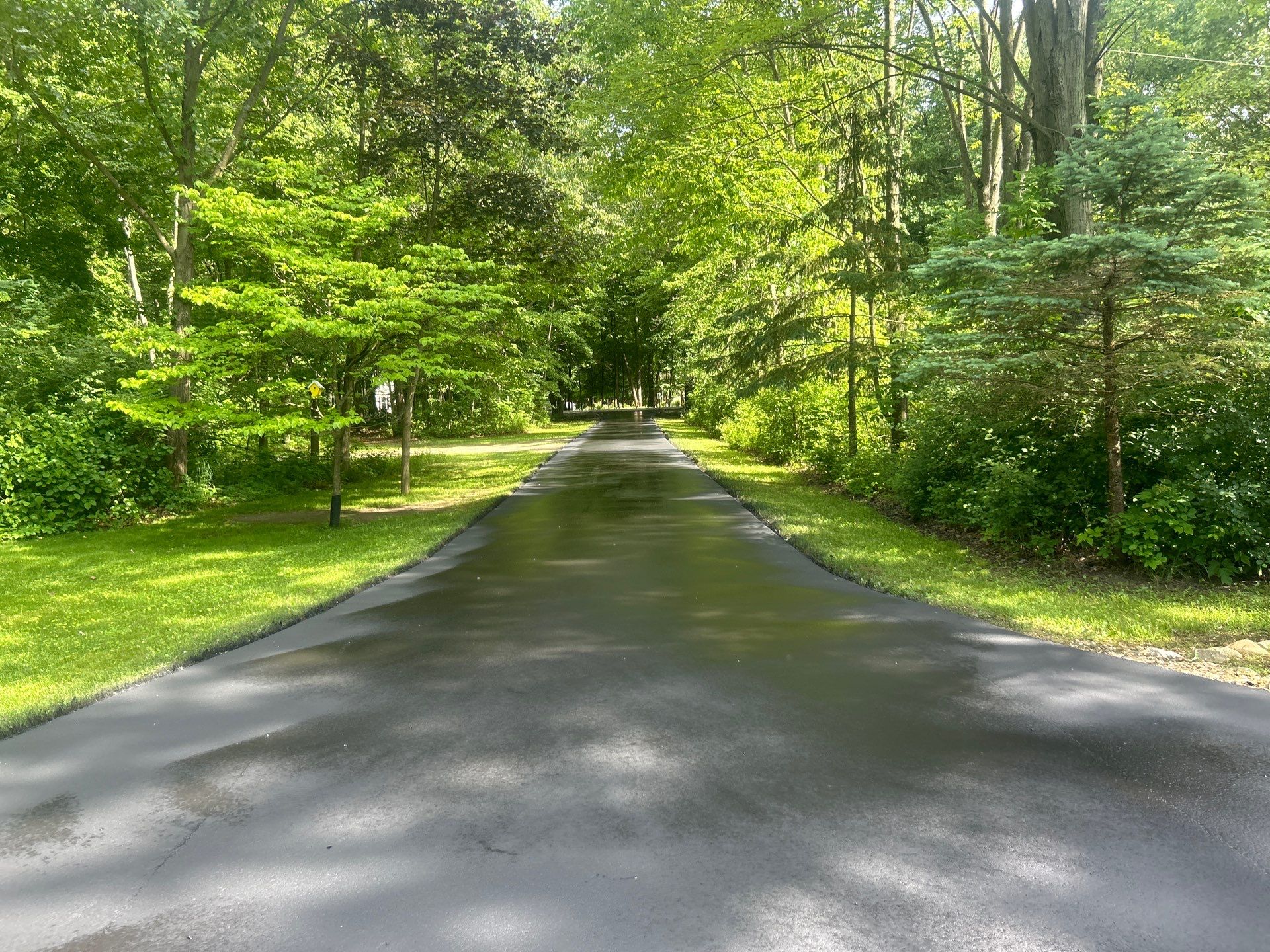 High end residential driveway by Quality Asphalt & Maintenance LLC
