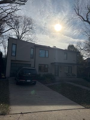 Residential Roofing Installation using Shingle and Flat Roof Combo