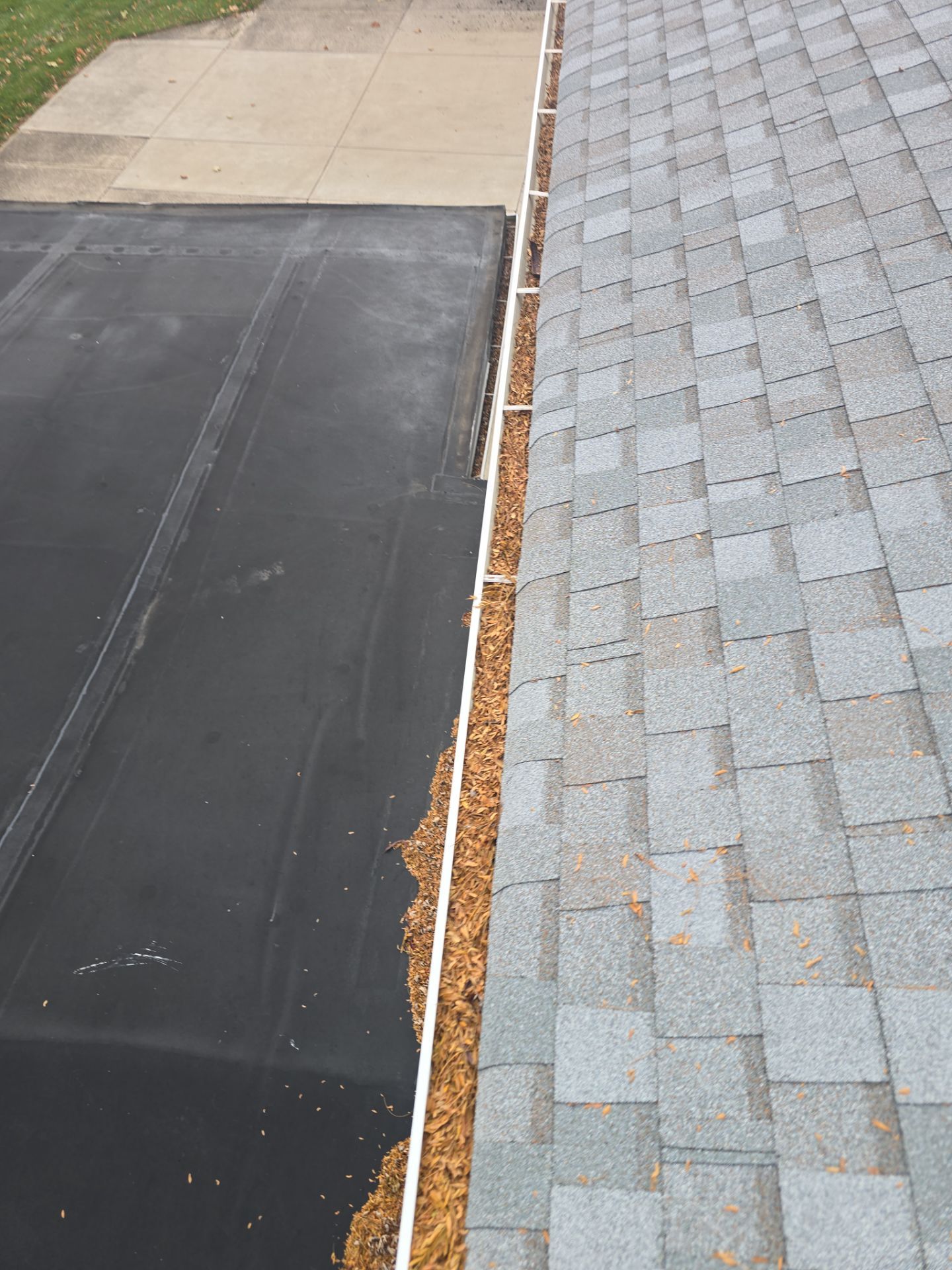 Commercial gutter cleaning Dayton before photo with filled gutters