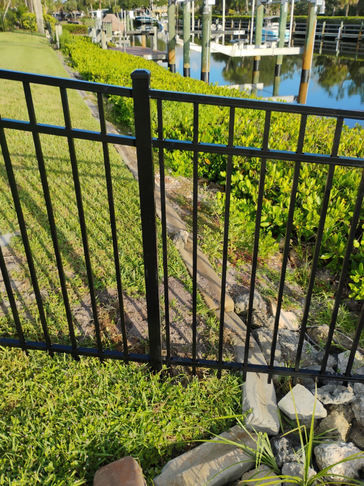 Black Aluminum Waterfront Fence Installation in Osprey by True Fence LLC