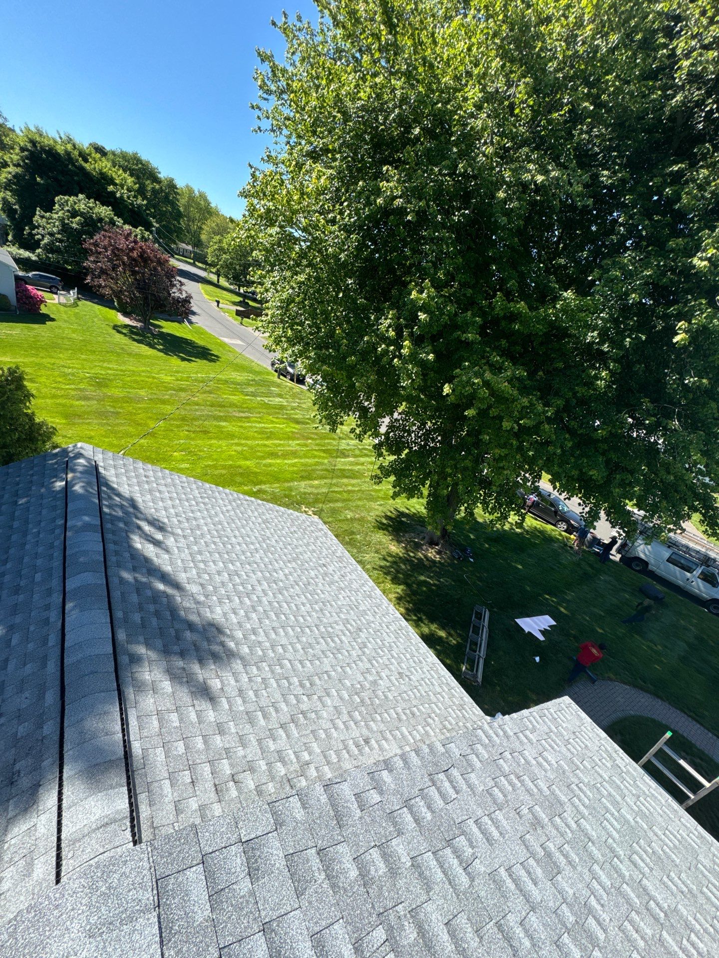Beautiful new asphalt shingles on a roof in Vernon! by DiGiorgi Roofing and Siding Inc