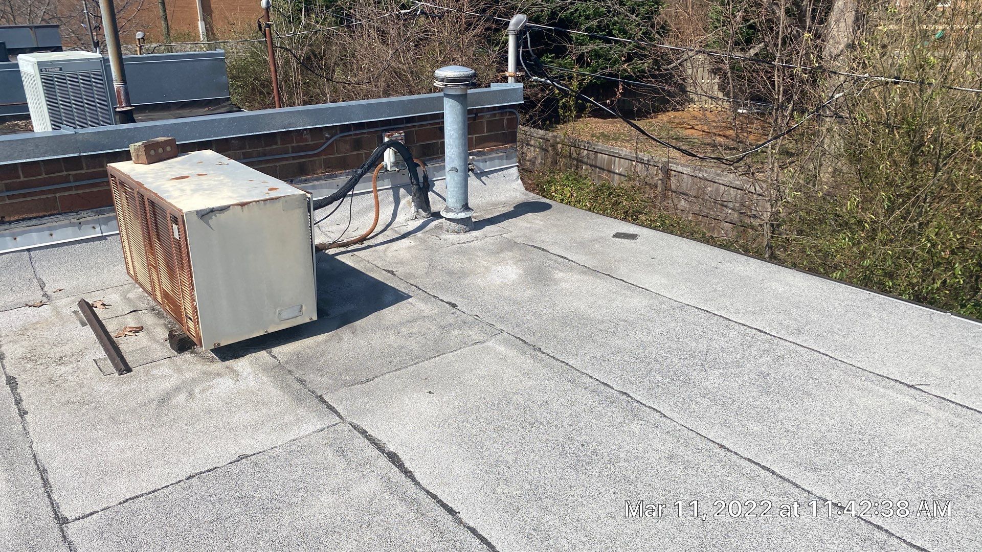Commercial Roof Coating using Fiberseal basecoat and Silicon Topcoat by Just In Time Roofing and Restoration